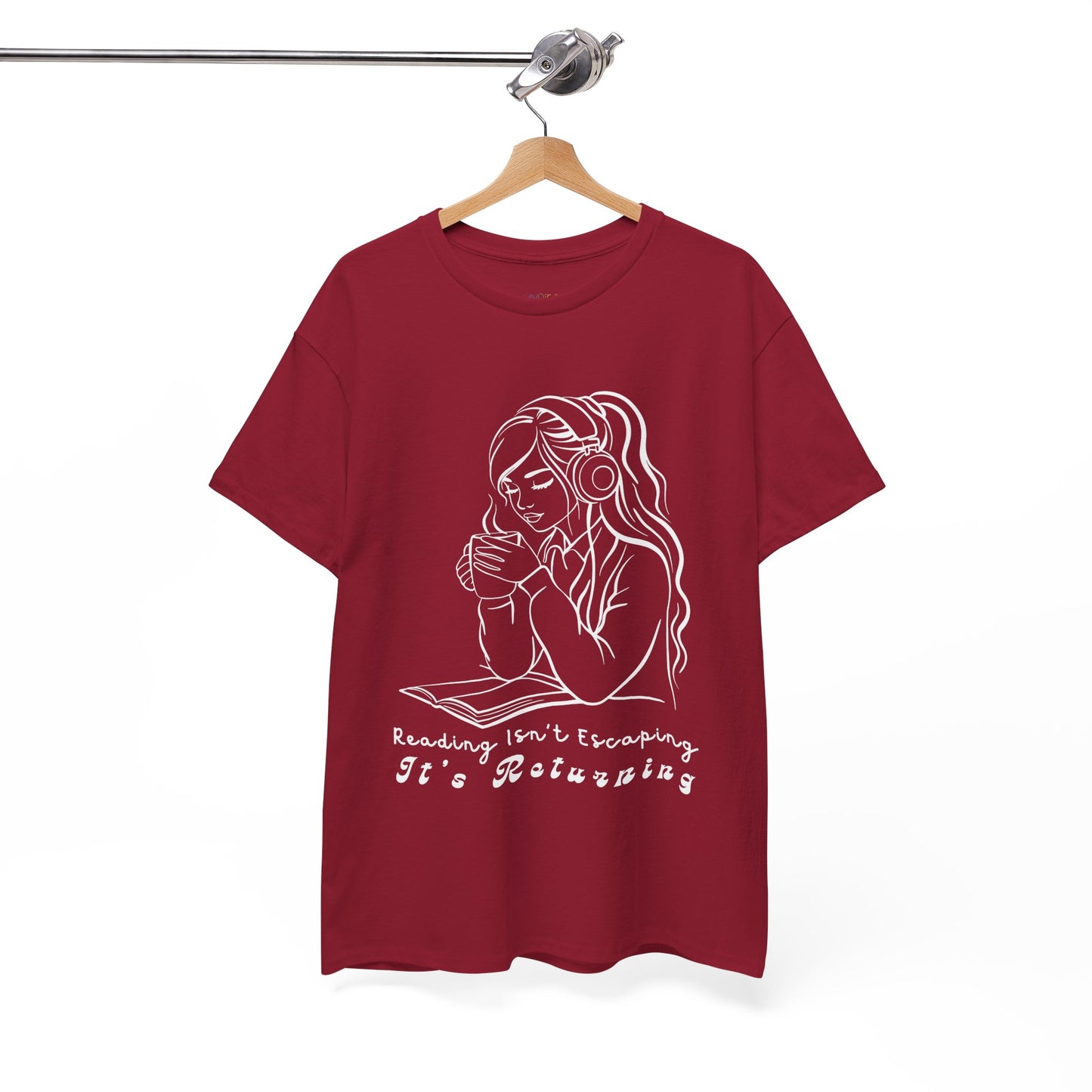 Red t-shirt with a woman wearing headphones, cupping a hot beverage and reading a book, text 'Reading Isn't Escaping, It's Returning'