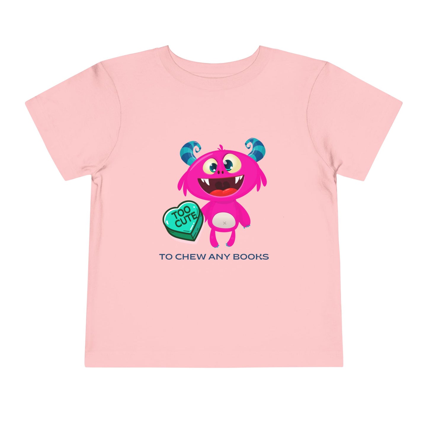 Pink toddler t-shirt with a cartoon gapped tooth monster, a turquoise heart with text 'too cute' and additional text 'to chew any books'