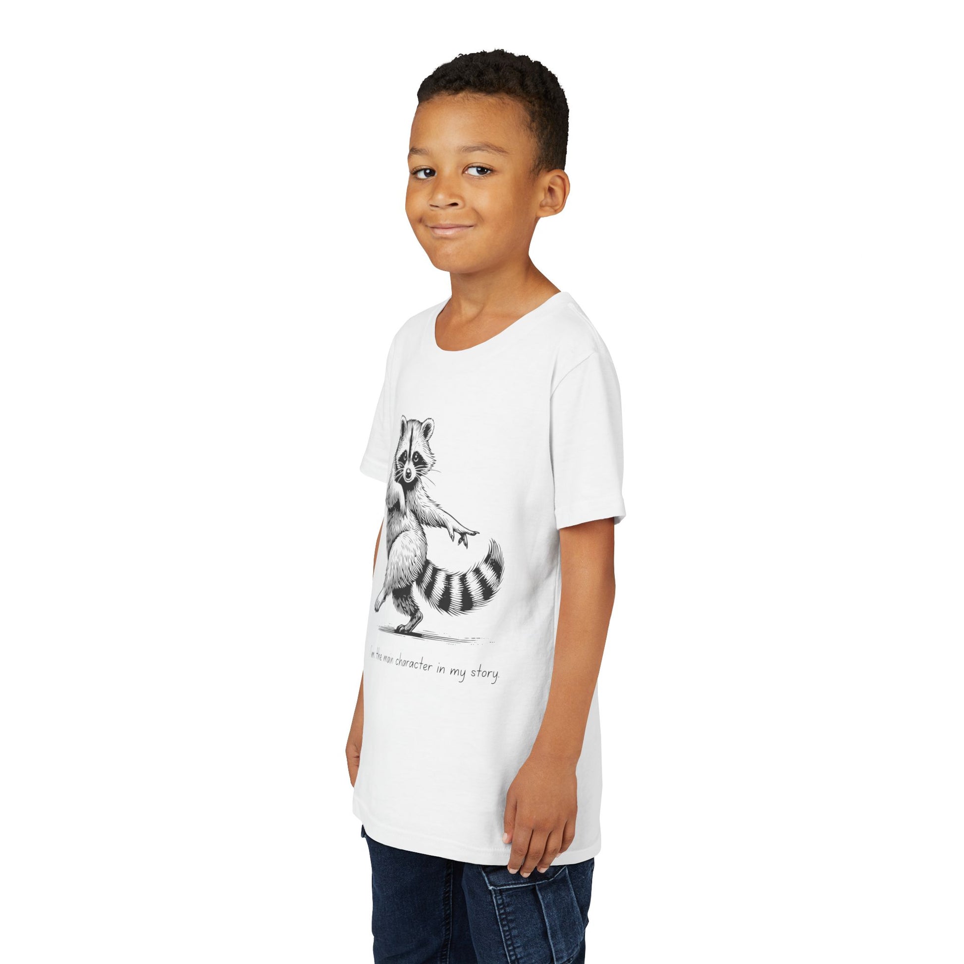 Boy wearing a white t-shirt with a dancing raccoon and text 'I'm the main character in my story'