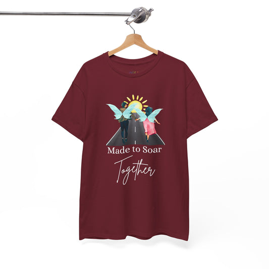 Maroon t-shirt with graphic design of two fairies running down the toward toward the sunset and text 'Made To Soar Together' and text 'Made to Soar Together' 