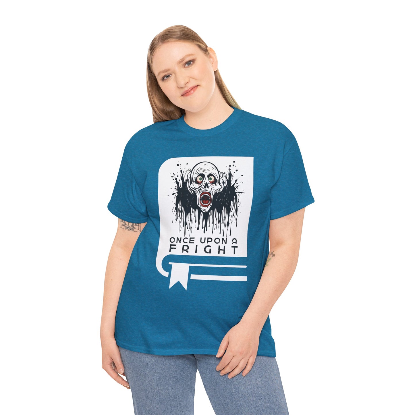 Woman wearing a blue t-shirt with a graphic design of creepy skeleton graphic on a book cover and text 'Once Upon a Fright' on a hanger against a white background.