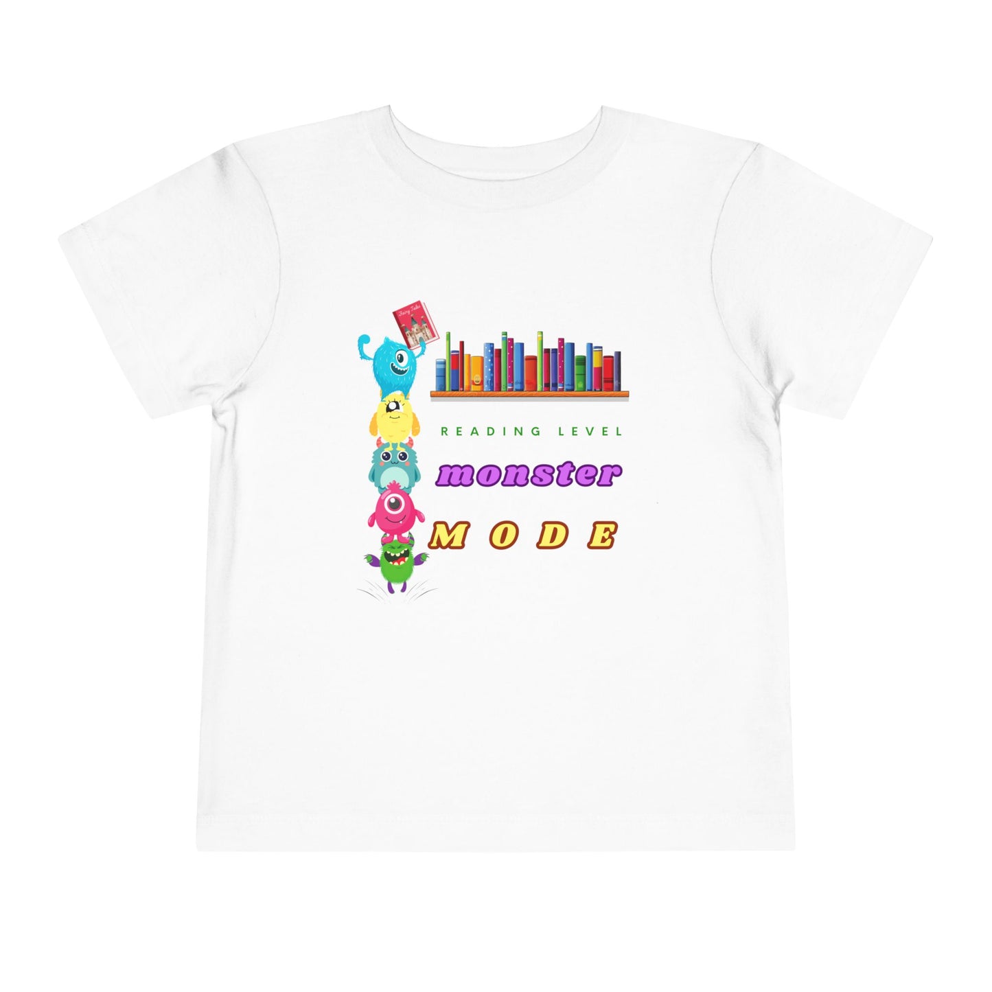 White toddler t-shirt with colorful monsters stacked on top of each other to reach a book from a bookshelf and text 'Reading Level Monster Mode'