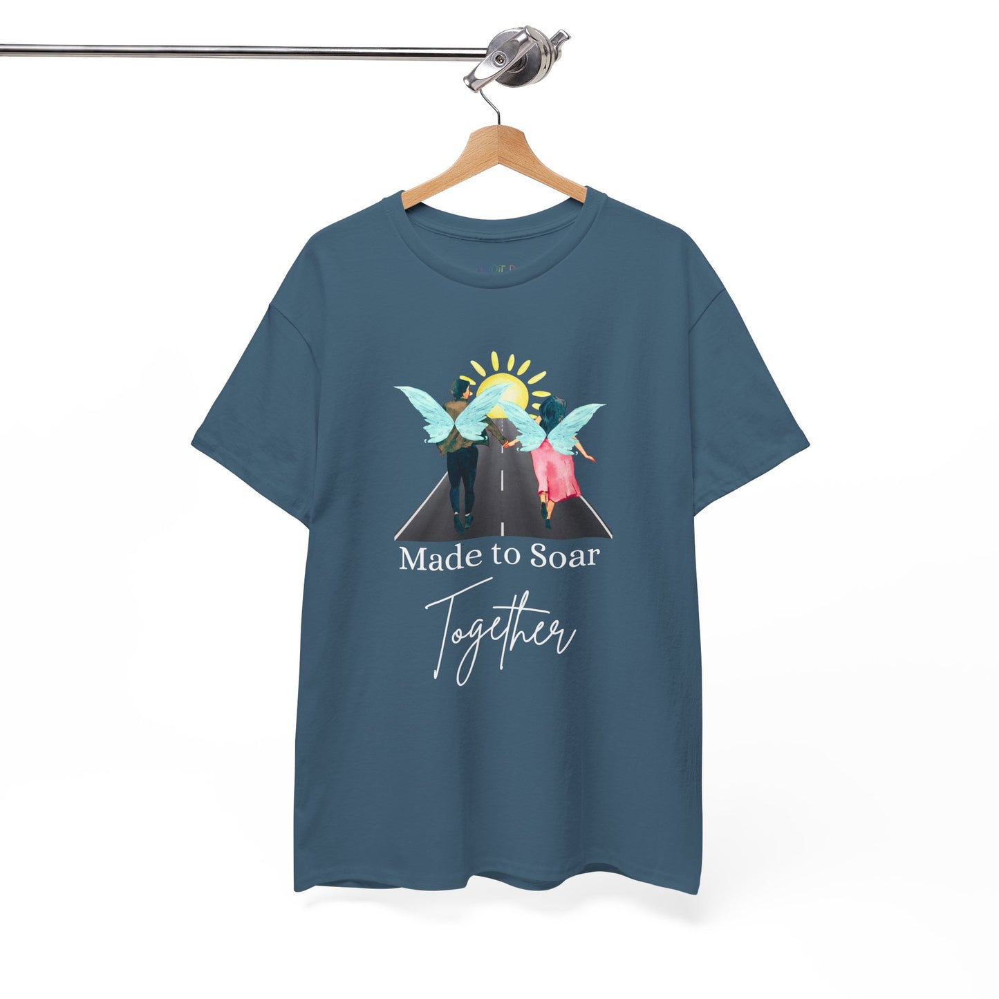 Teal t-shirt with graphic design of two fairies running down the toward toward the sunset and text 'Made To Soar Together' and text 'Made to Soar Together' 