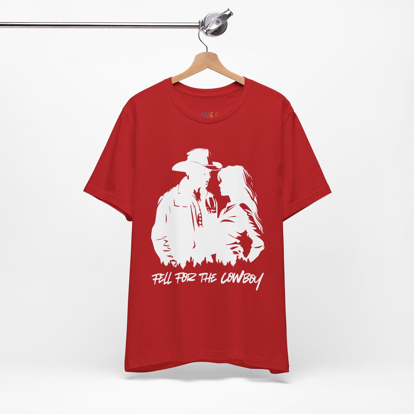 Red t-shirt with white graphic of a man and a woman, text says 'Fell for the Cowboy'