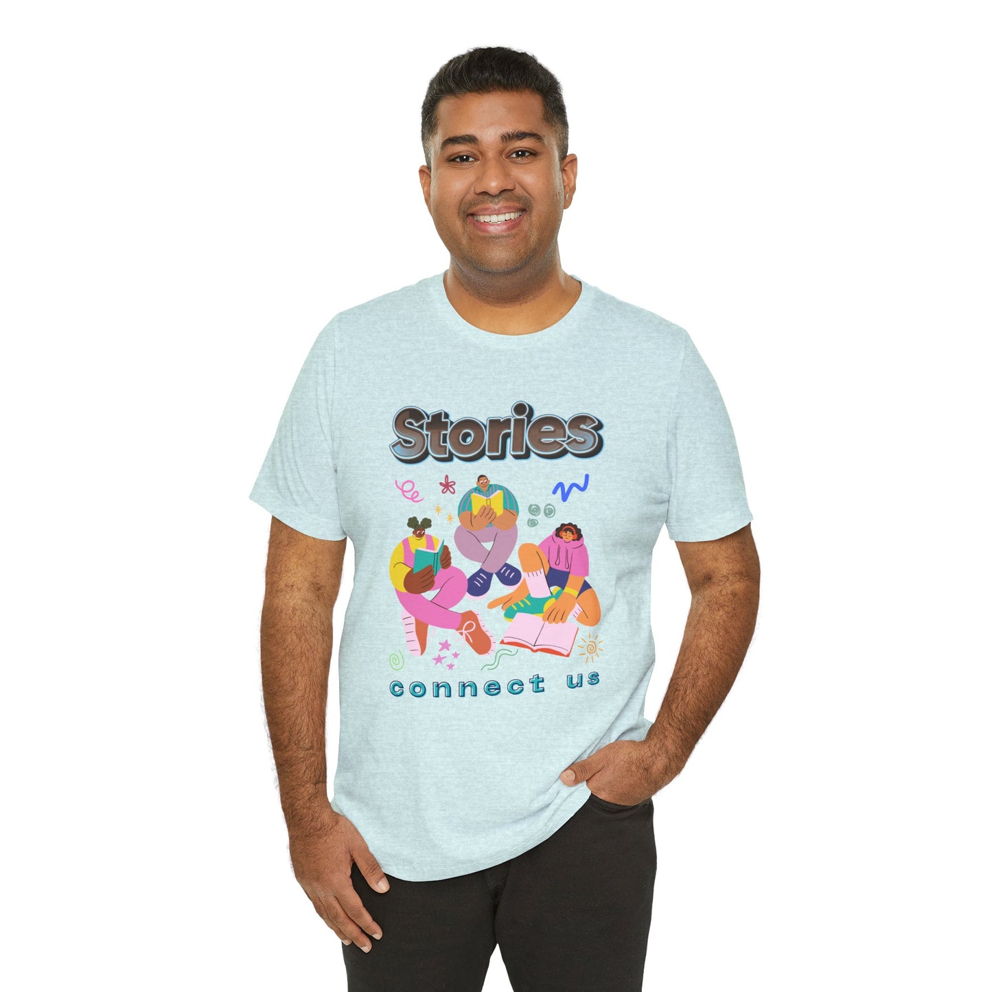 Man wearing a light ice blue t-shirt with colorful modern people reading, surrounded by doodles, and text 'Stories connect us' 