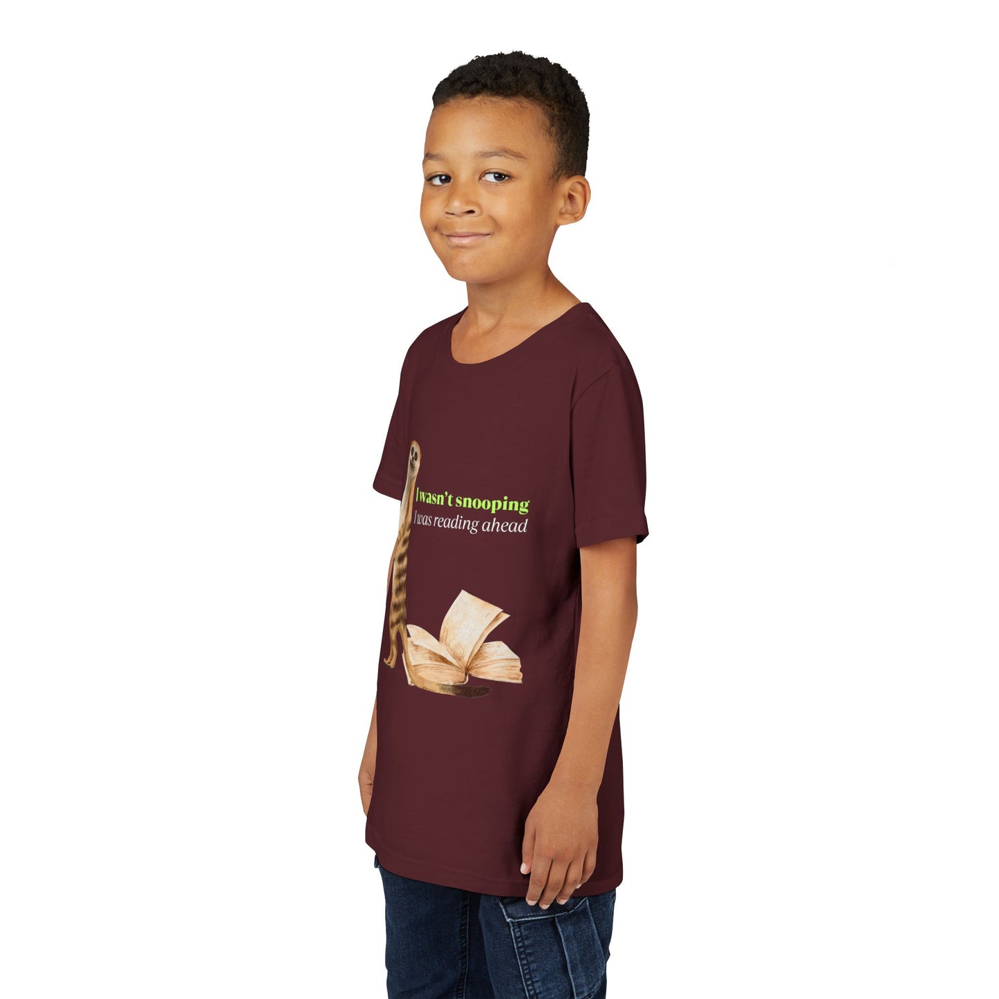 Boy wearing a maroon t-shirt with a guilty looking meerkat and book graphic, text 'I Wasn't Snooping. I Was Reading Ahead.'