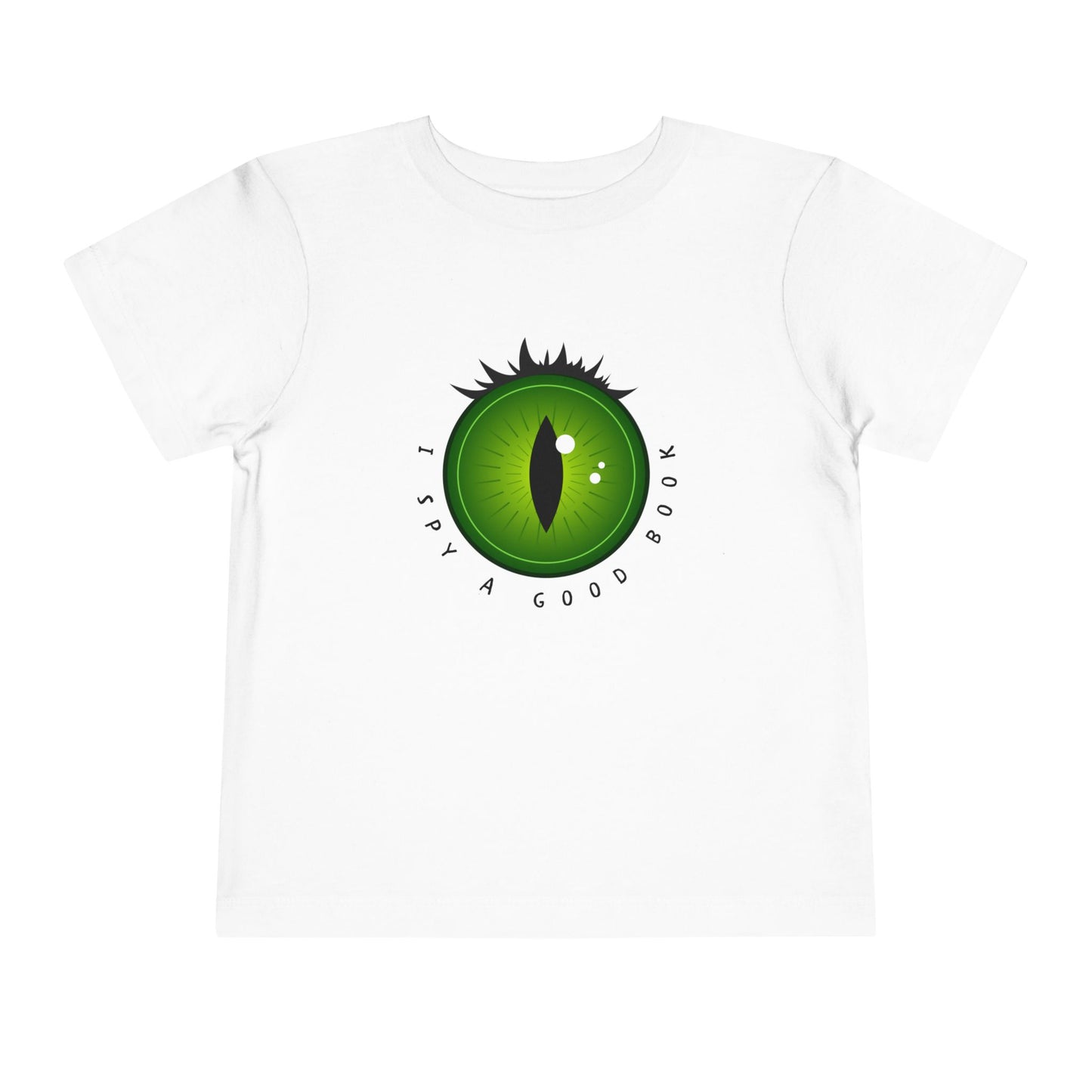 White t-shirt with a green dragon eye design and text 'I SPY A GOOD BOOK'