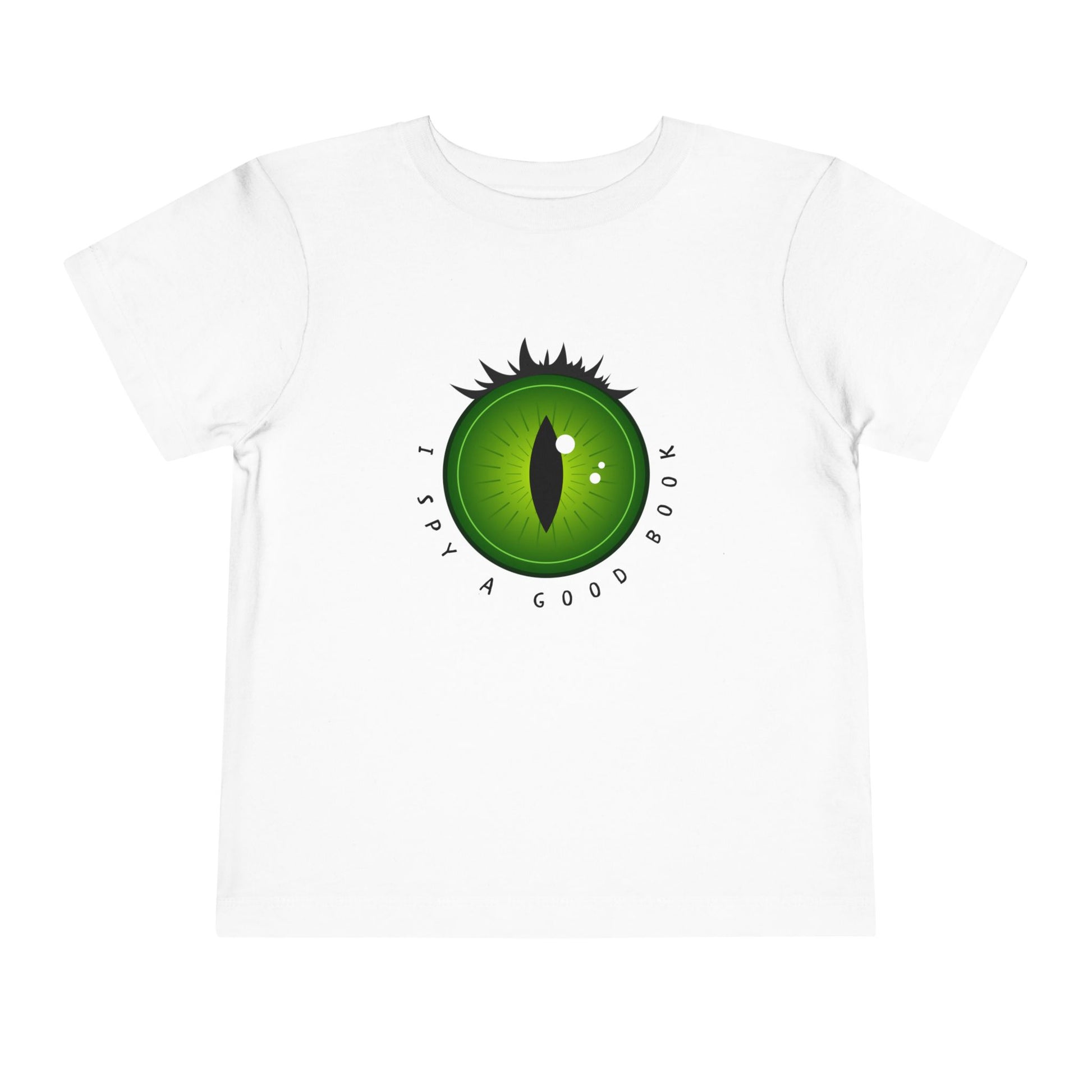 White t-shirt with a green dragon eye design and text 'I SPY A GOOD BOOK'