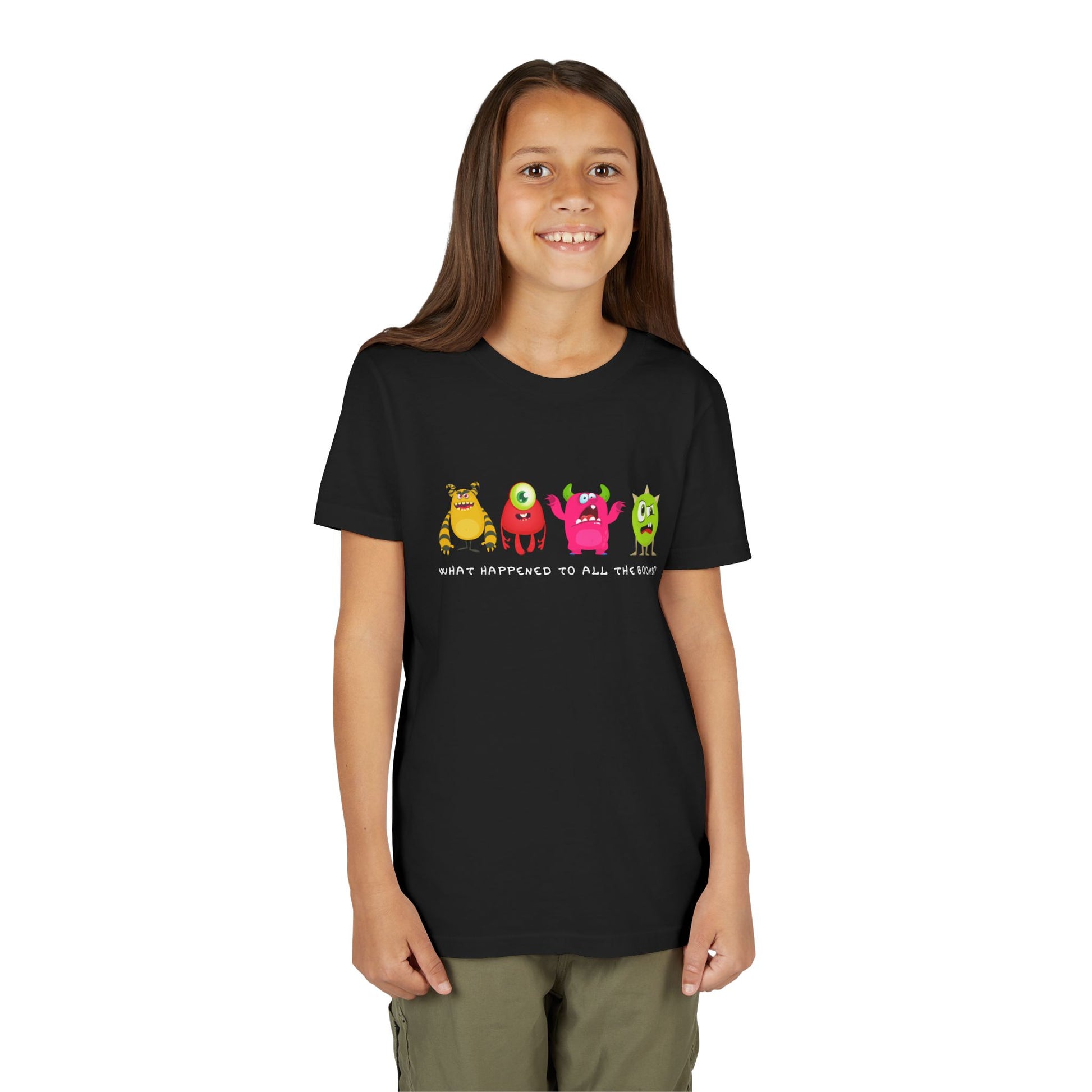 Girl wearing a black t-shirt with four colorful cartoon monsters looking grumpy, confused and bewildered, text 'What happened to all the books?'