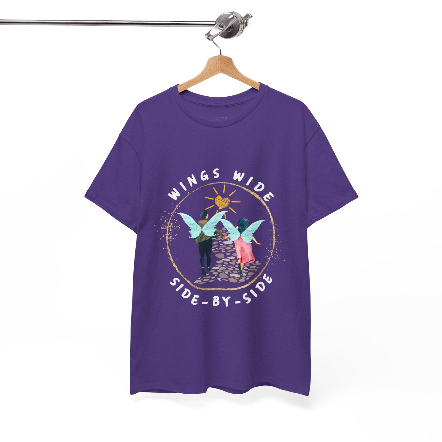 Purple t-shirt with a fairy couple running off into the sunset down a cobblestone path and text 'Wings Wide Side-By-Side'