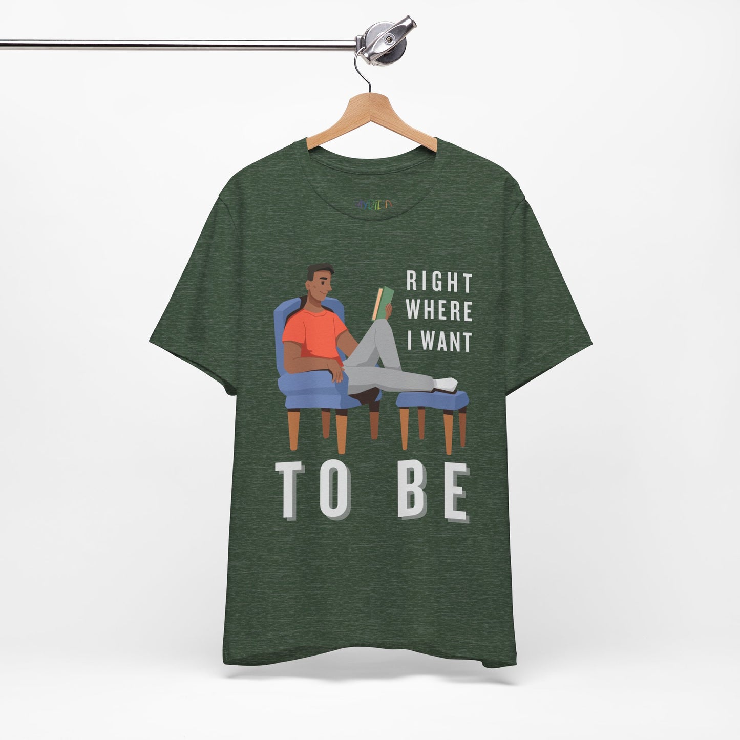 Heather forest t-shirt with a man lounging in a chair, feet up, book in hand and text 'Right Where I Want To Be'