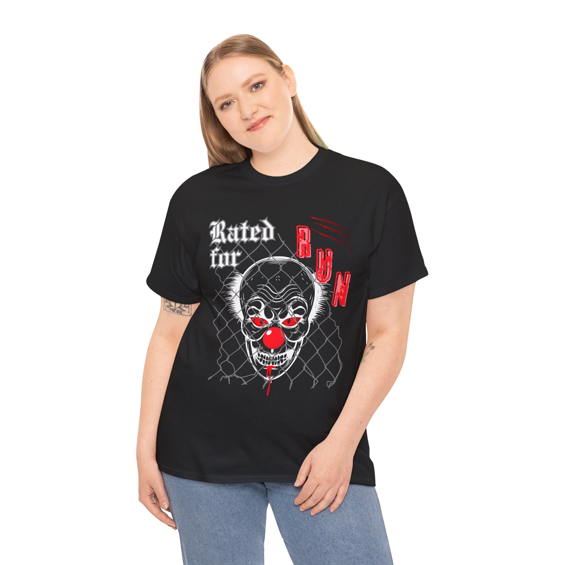 Woman wearing a black horror t-shirt with a graphic design of a scary clown face behind chain linked fence and text 'Rated for R' on a hanger against a white background