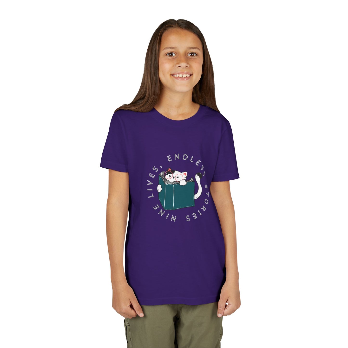 Girl wearing a purple t-shirt with a cat reading a book graphic and text 'nine lives, endless stories'