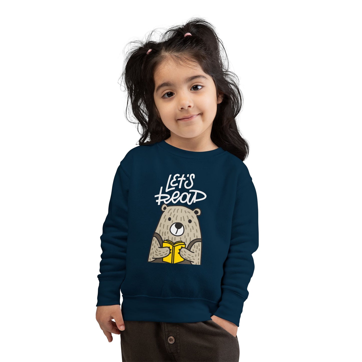 Girl wearing a navy blue toddler sweatshirt with bear holding a book and 'Let's Read' text 