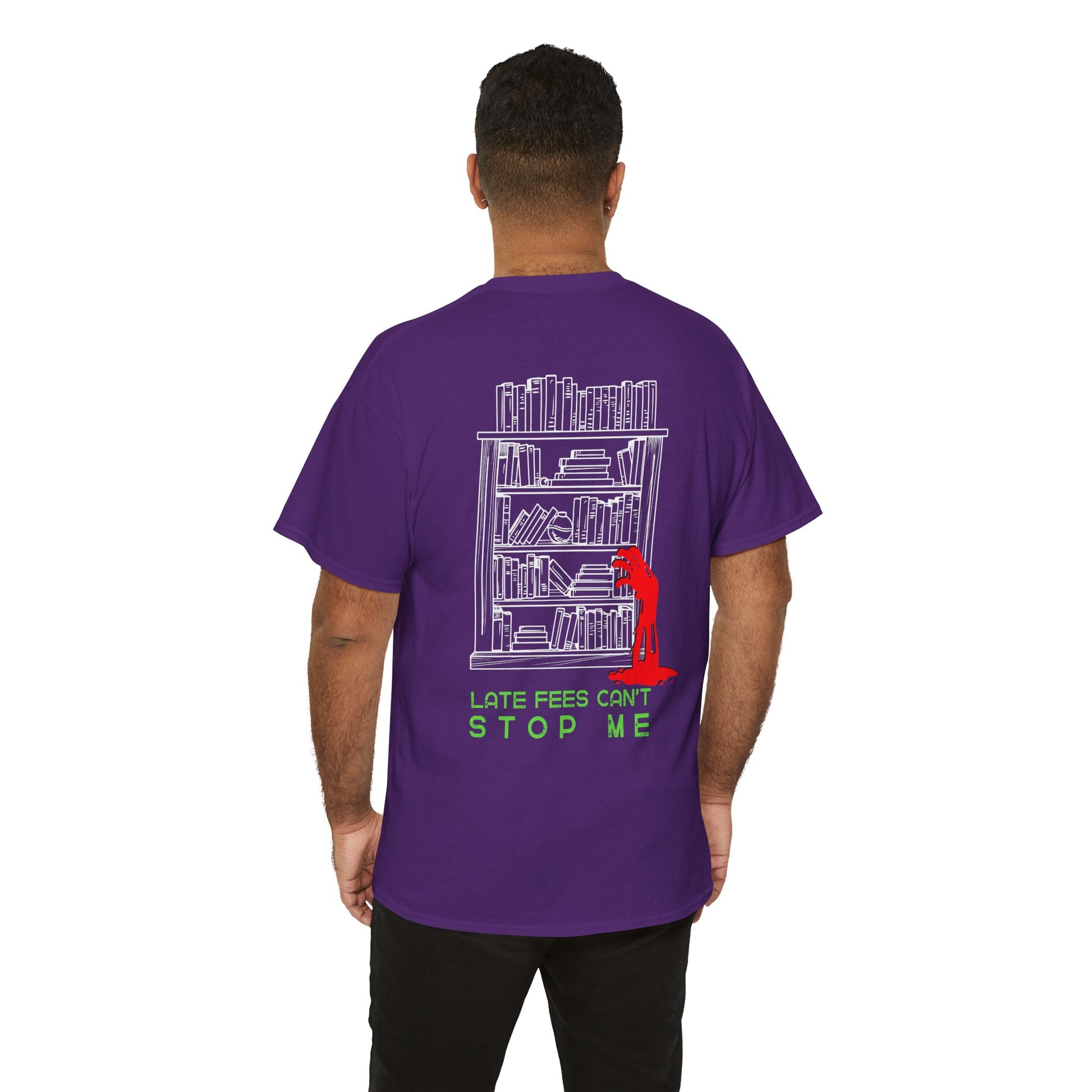 Man wearing a purple dual-sided t-shirt with a small librarian pushing a cart on the front and a full size bookshelf with a zombie hand reaching up on the back, text 'Late Fees Can't Stop Me'