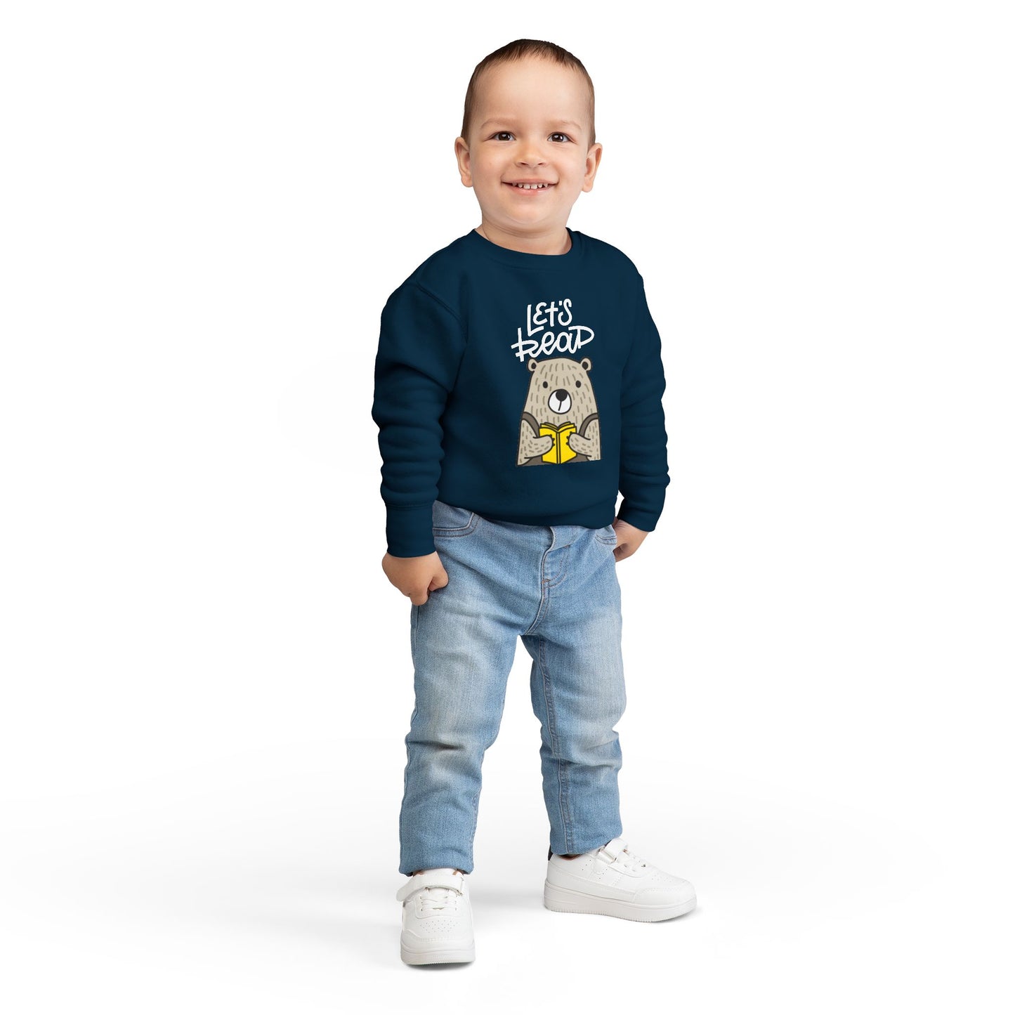 Boy wearing a navy blue toddler sweatshirt with bear holding a book and 'Let's Read' text 