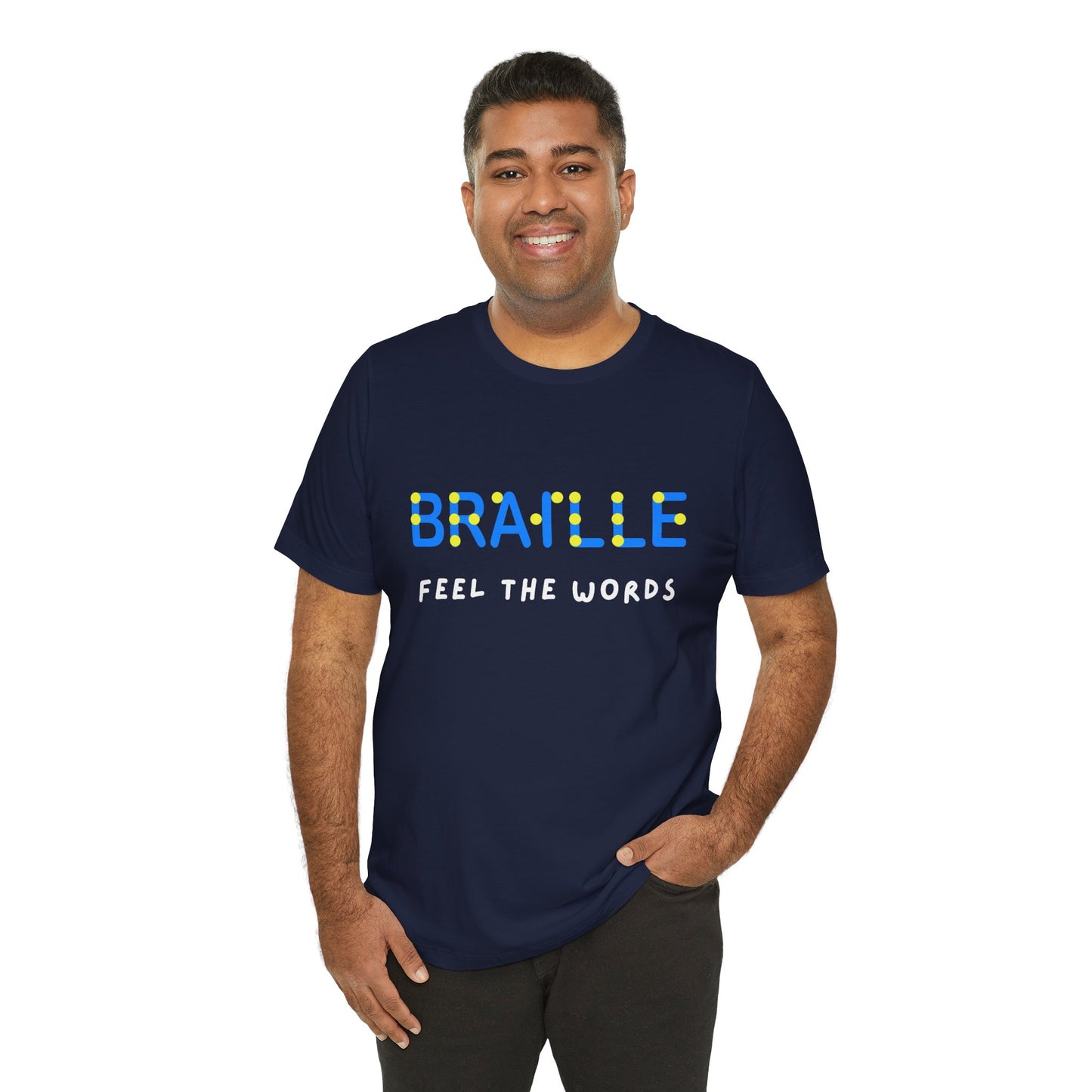 Man wearing a navy blue t-shirt with blue, yellow and white text 'Braille Feel the Words' 