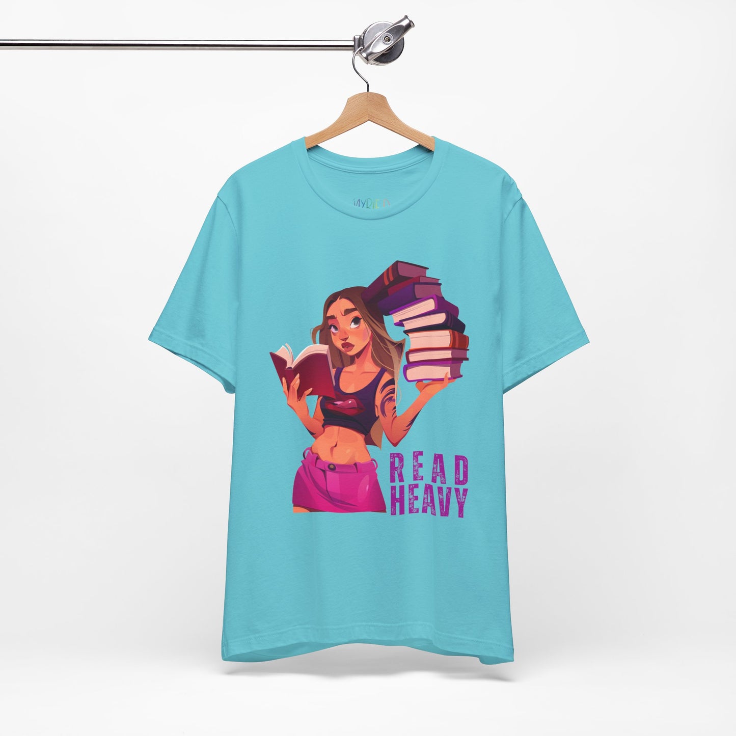 Turquoise t-shirt with a stylish woman graphic reading a book in one hand and holding a stack of books in the other, and the text 'Read Heavy' 
