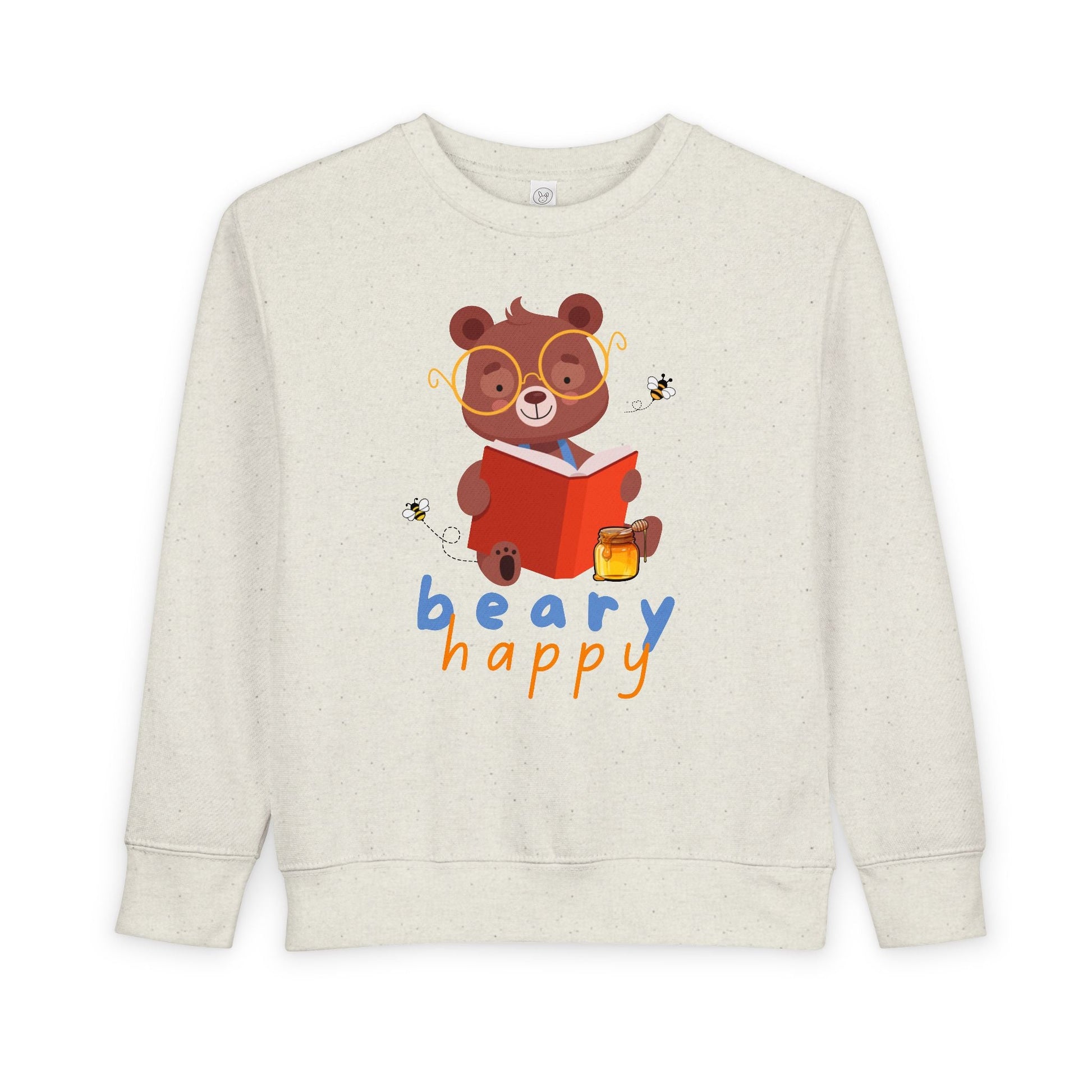 Beige toddler sweatshirt with a bear wearing large yellow glasses and reading a book with a smackrel of honey nearby for a snack and text 'beary happy' on a white background