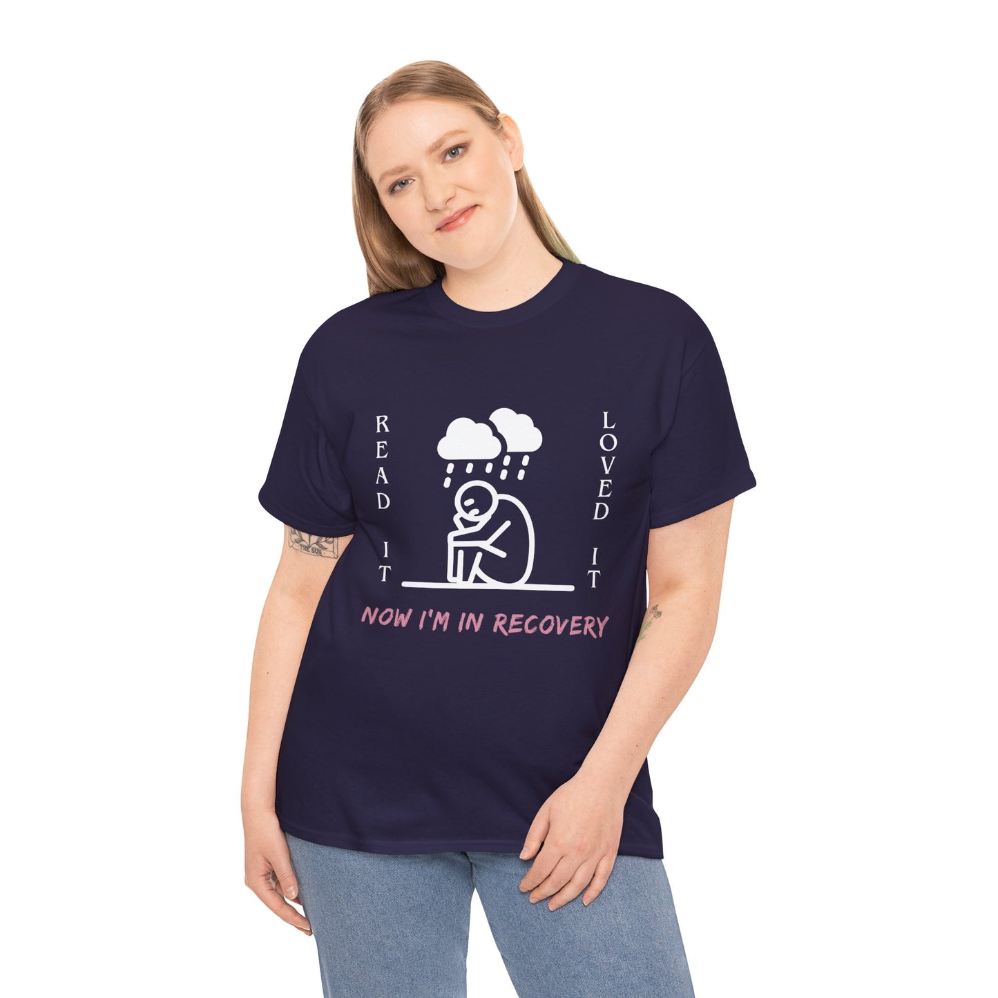 Woman wearing a dark (blackberry) t-shirt with a white graphic of a sad stick figure sitting under a cloud and text 'Read It. Loved It. Now I'm In Recovery.' 