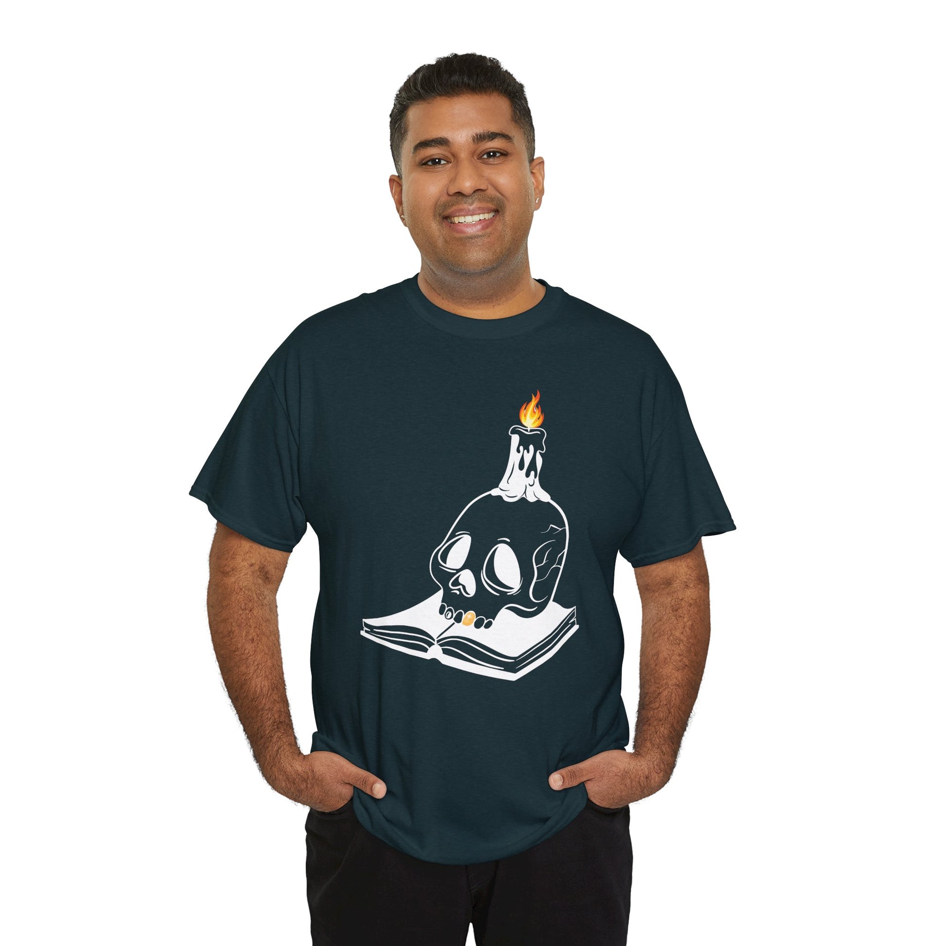 Man wearing a midnight t-shirt with a graphic design of a skull and candle on an an open book