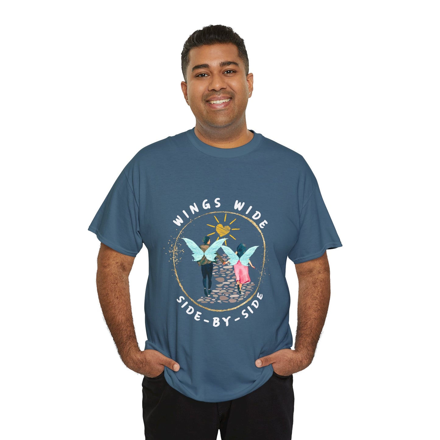 Man wearing a teal t-shirt with a fairy couple running off into the sunset down a cobblestone path and text 'Wings Wide Side-By-Side'
