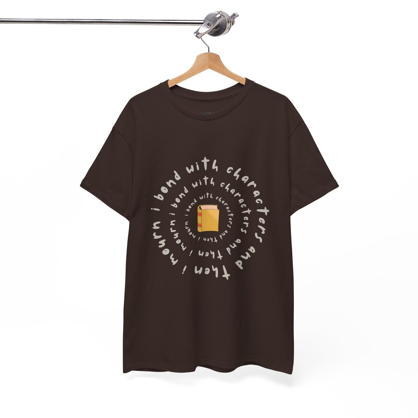 Brown blue t-shirt with a small book at the center and layered spiral text 'I Bond With Characters & Then I Mourn'
