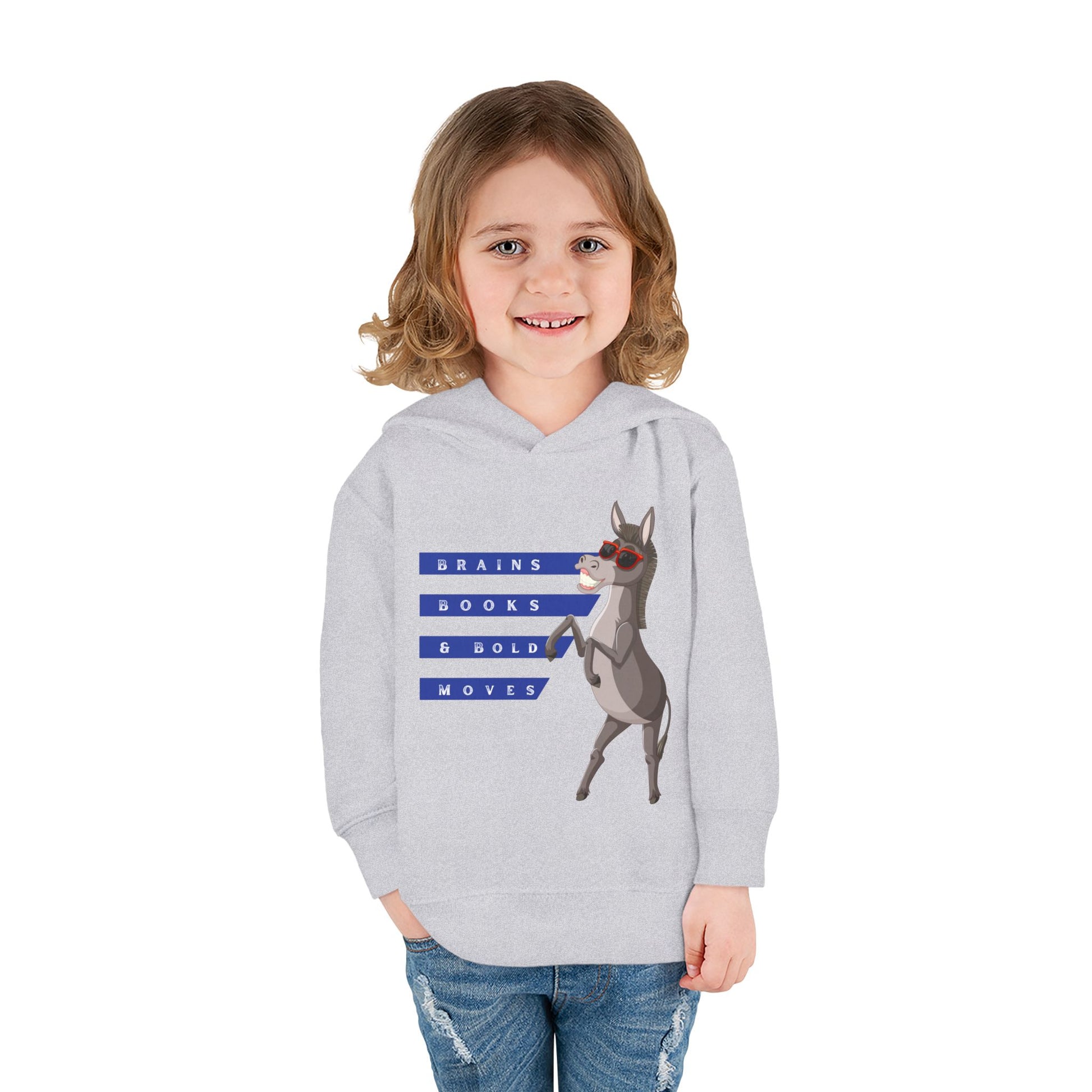 Girl wearing a light gray toddler sweatshirt featuring Donkey Dell in cool red sunglasses and text 'Brains, Books, & Bold Moves' on a white background