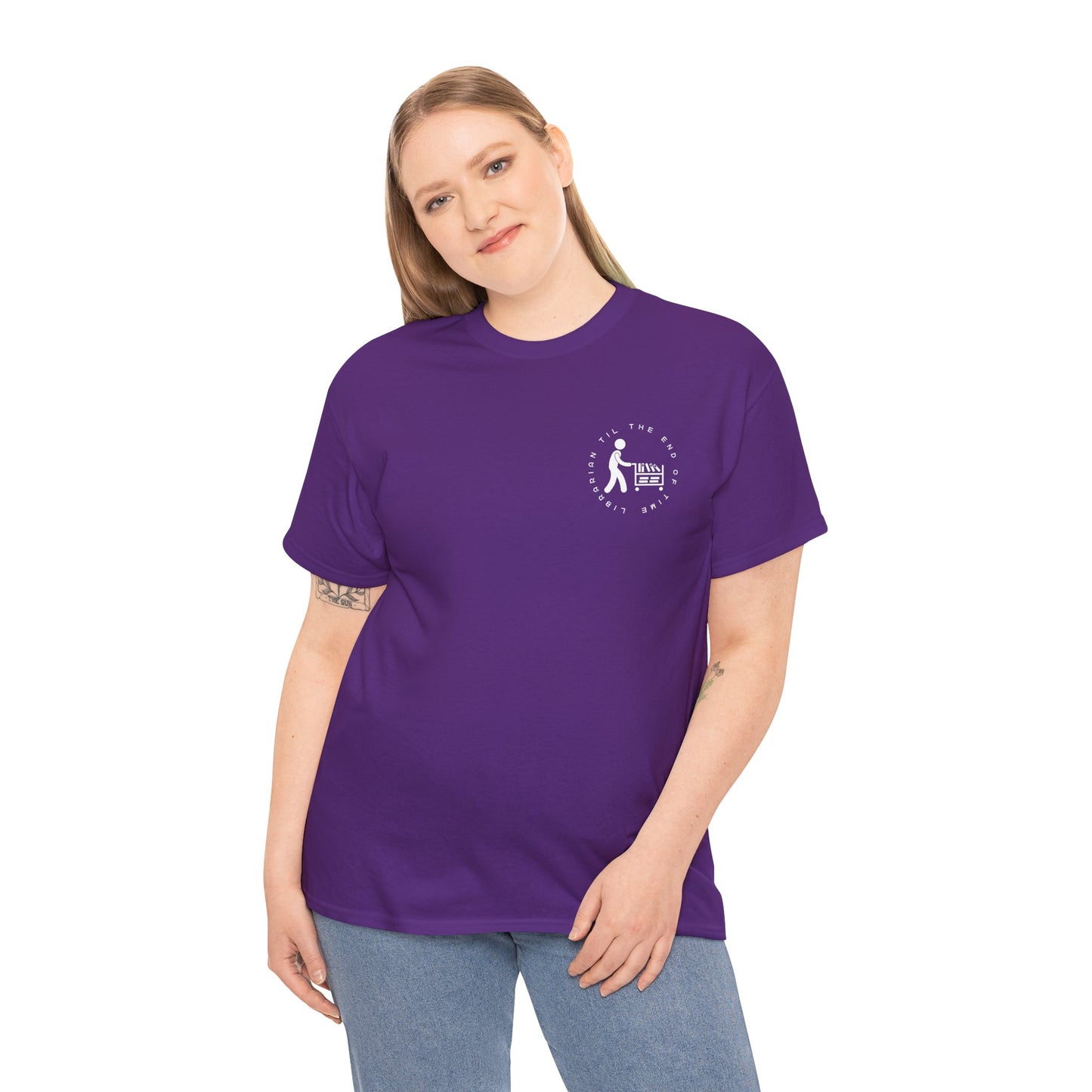 Girl wearing a purple dual-sided t-shirt with a small librarian pushing a cart on the front and a full size bookshelf with a zombie hand reaching up on the back, text 'Late Fees Can't Stop Me'