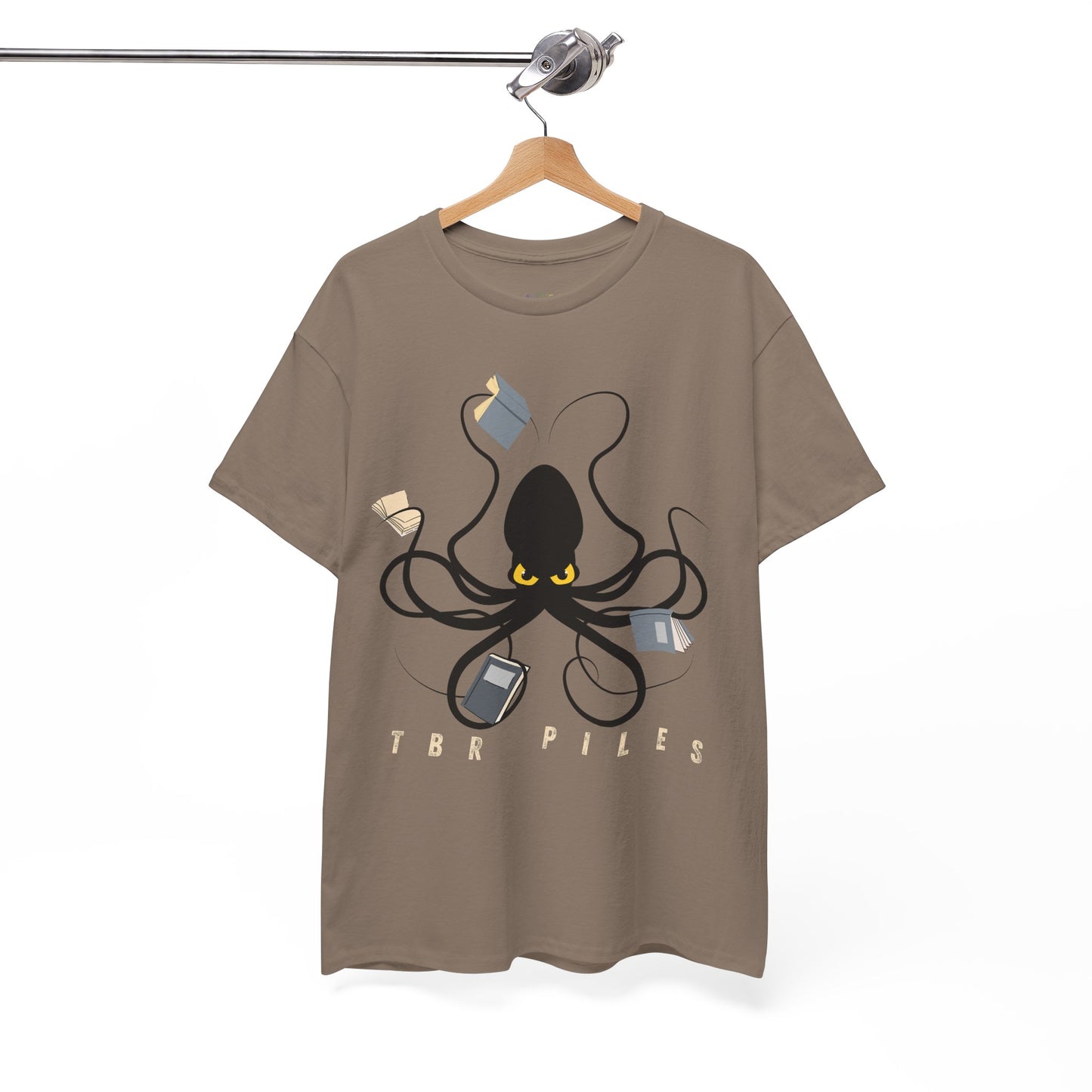Brown t-shirt with a yellow eyed black octopus  holding several books and text 'TBR PILES' 