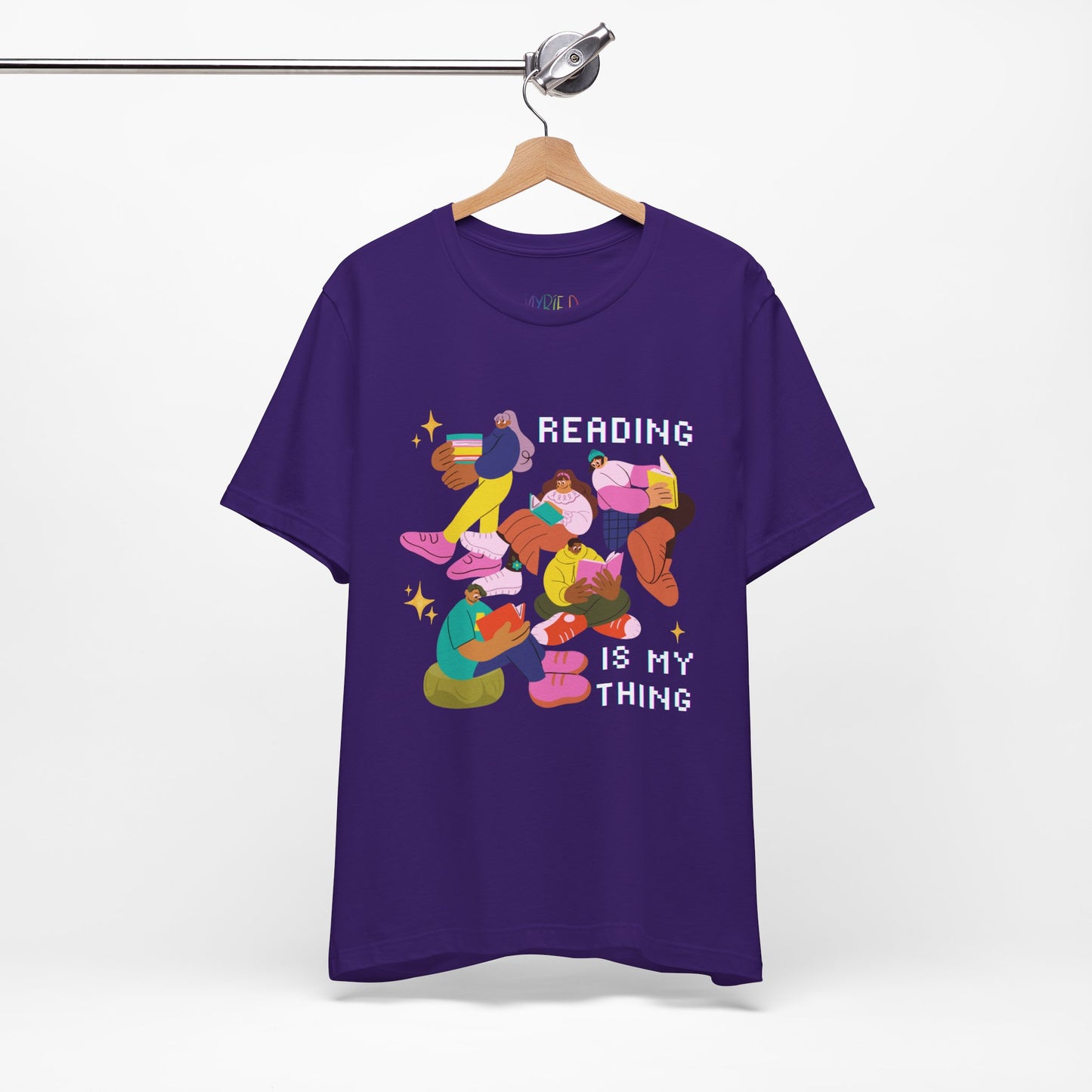 Purple t-shirt with colorful modern people reading books and 'Reading is my thing' text 