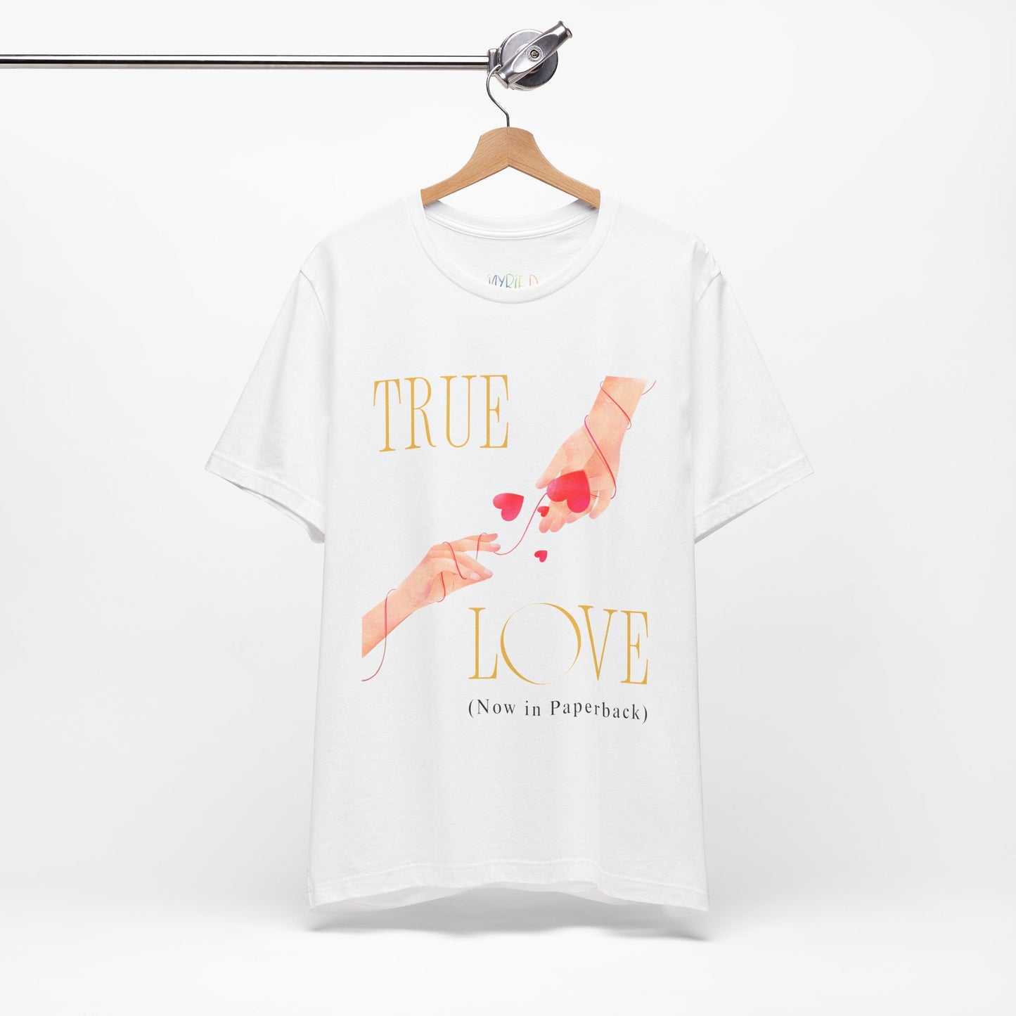 White t-shirt with 'True Love (Now in Paperback)' text and graphic of two hands reaching foreach other, entwined in red string and hearts