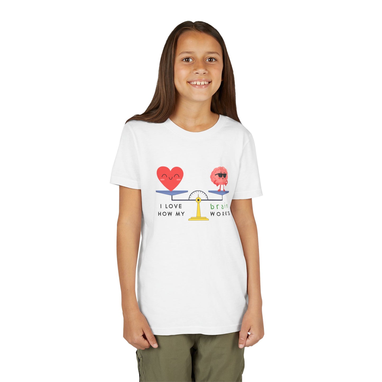 Girl wearing a white t-shirt with a graphic balanced scale design of a heart and brain with text 'I Love How My Brain Works'