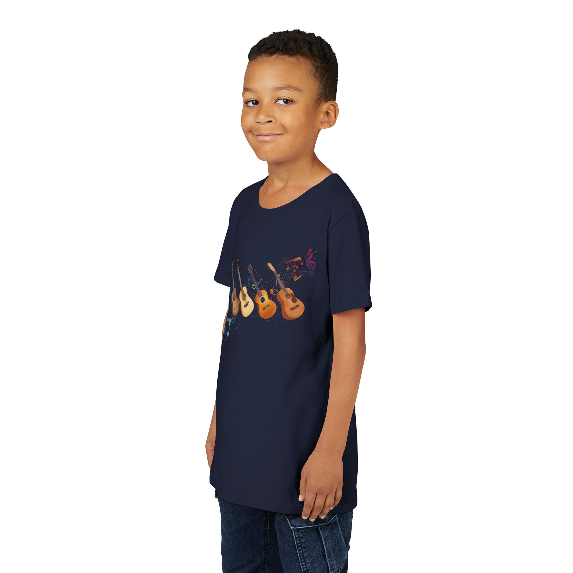 Boy wearing a navy blue t-shirt with colorful music notes and a row of guitars 