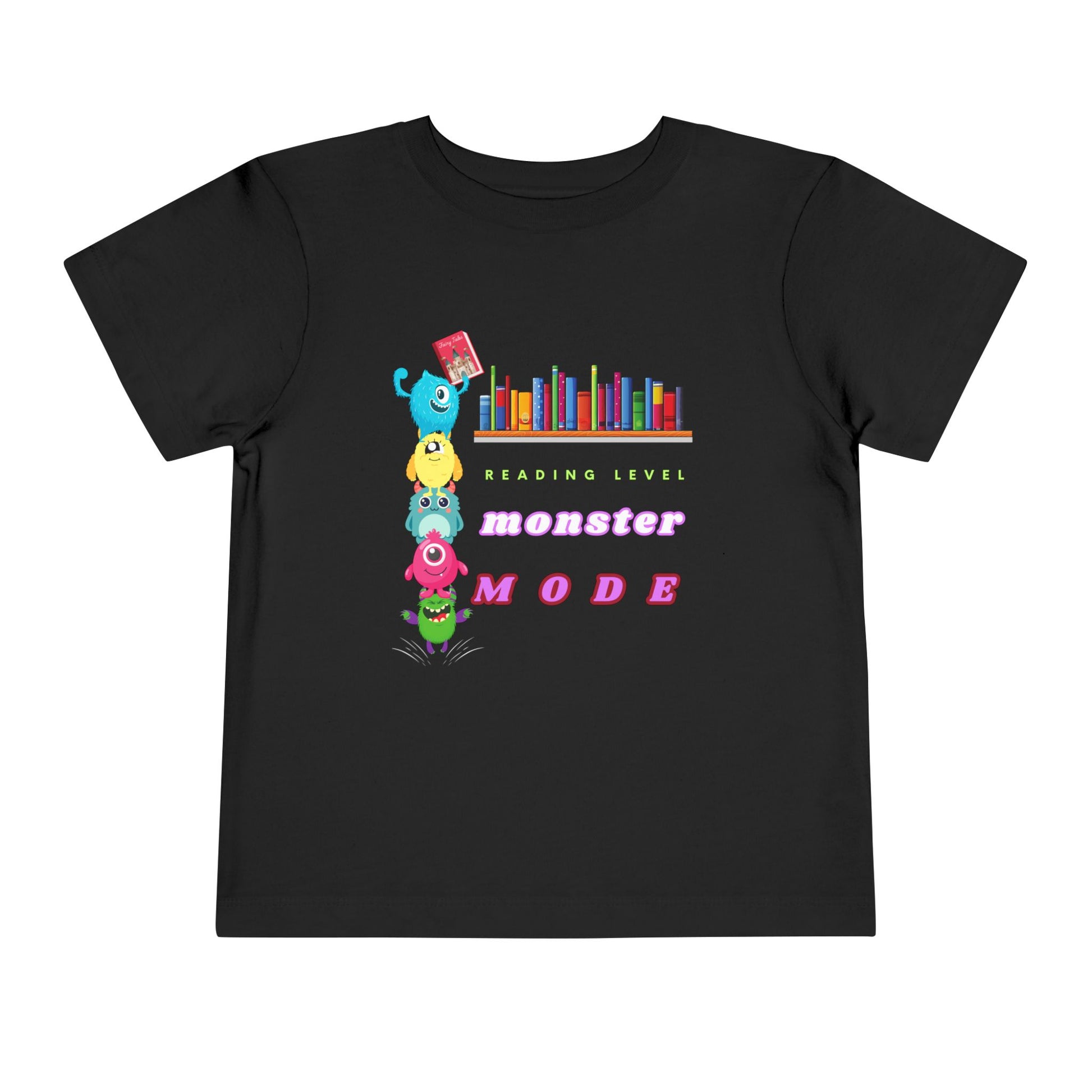 Black toddler t-shirt with colorful monsters stacked on top of each other to reach a book from a bookshelf and text 'Reading Level Monster Mode'