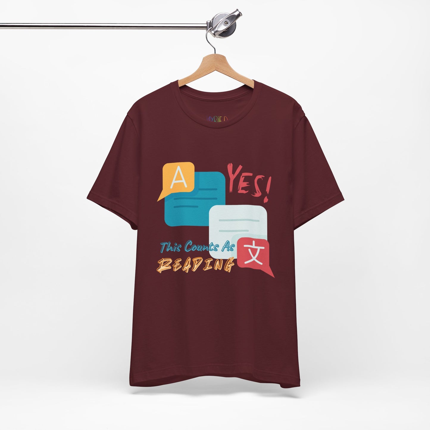 Maroon t-shirt with colorful instant messaging boxes and text 'YES! This Counts As Reading'