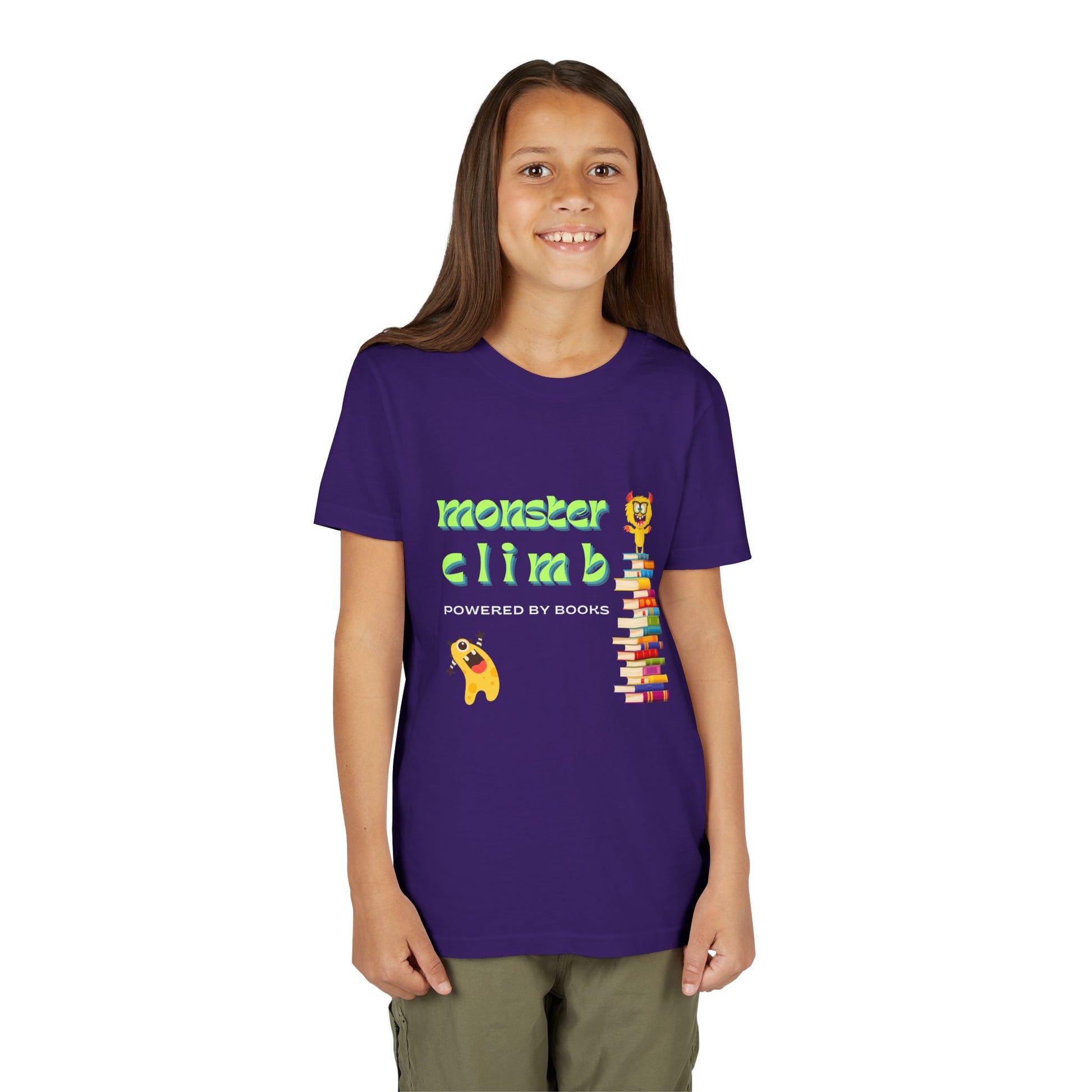Girl wearing a purple t-shirt with one very excited monster looking up at a fellow monster standing on top of a stack of books and text 'Monster Climb Powered By Books'