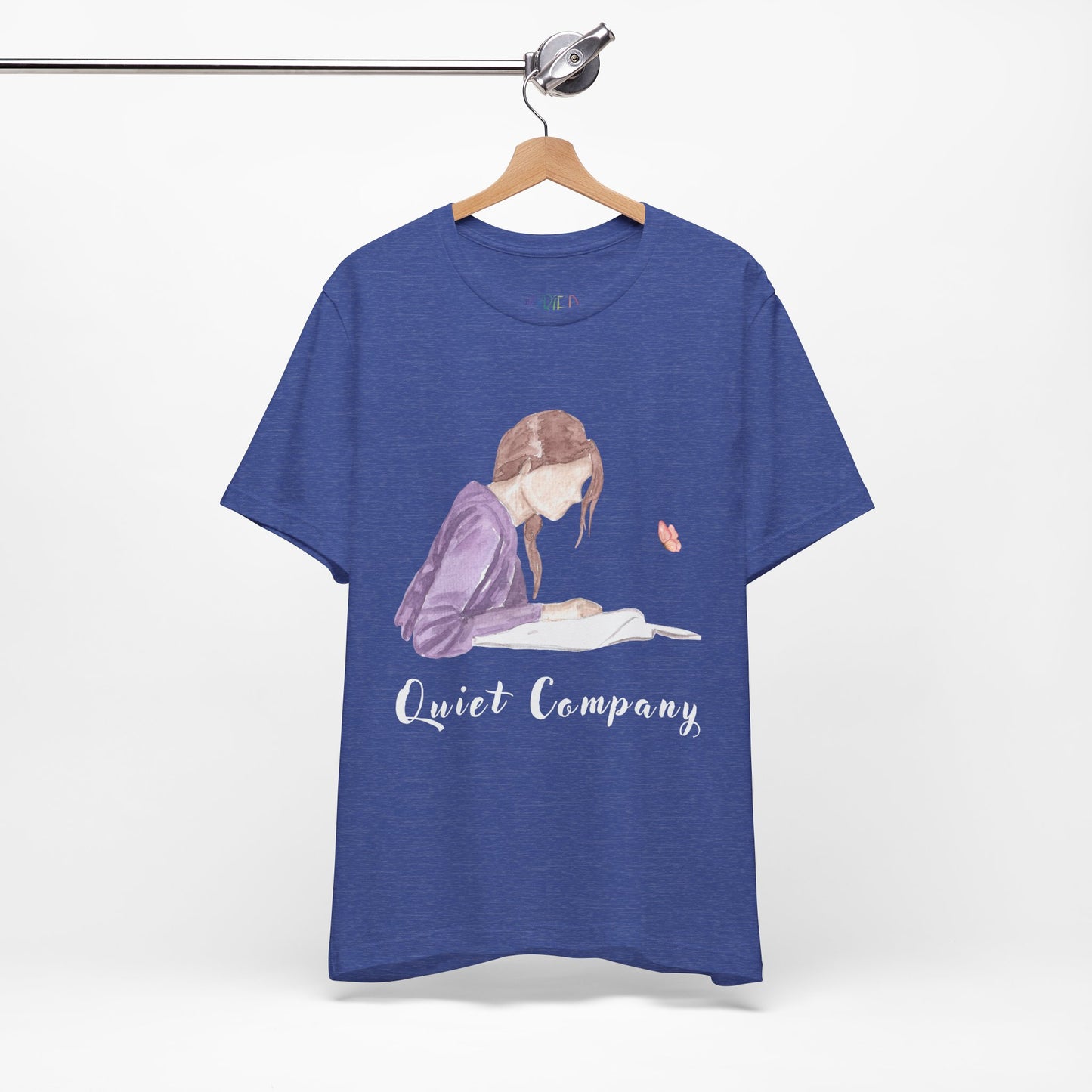 Blue t-shirt with a graphic of a girl reading a book and the text 'Quiet Company' 