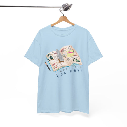 Light blue t-shirt with a An open scrapbook full of scribbles, tickets, newspaper clippings and more, text 'I Annotate For Fun' 
