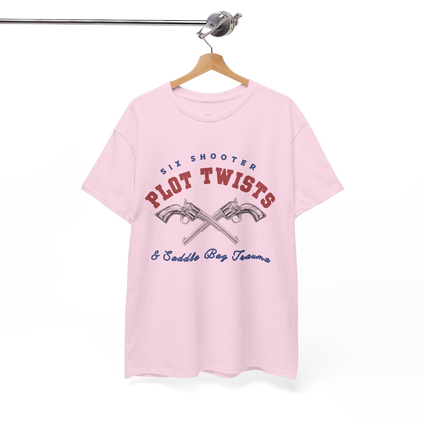 Pink t-shirt with two pistols criss-crossed in the center and text 'Six Shooter Plot Twists & Saddle Bag Trauma'