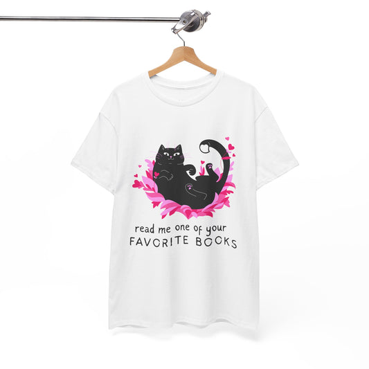 White t-shirt with a black cat laying in a pile of pedals and roses, text 'read me one of your favorite books'