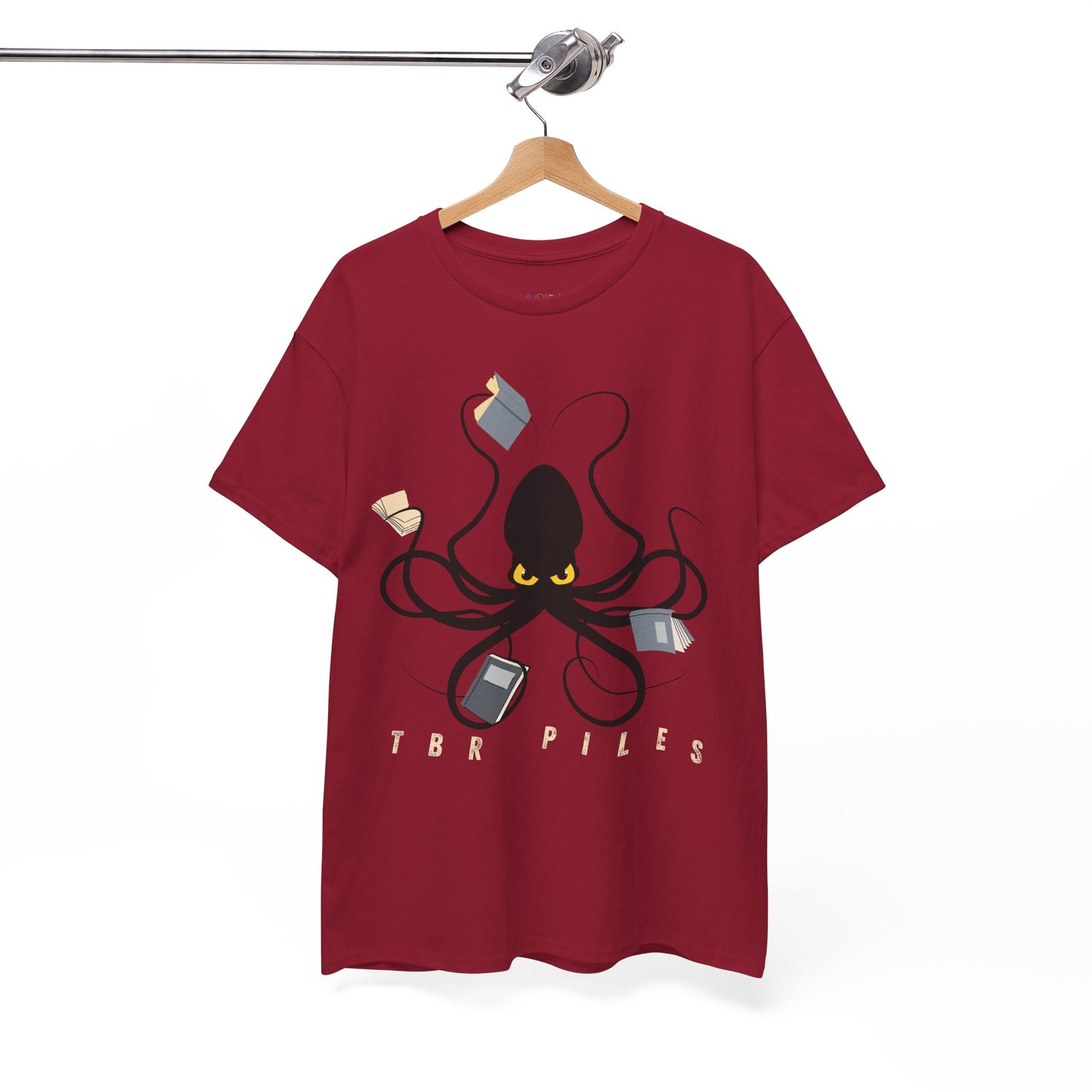 Red t-shirt with a yellow eyed black octopus  holding several books and text 'TBR PILES' 