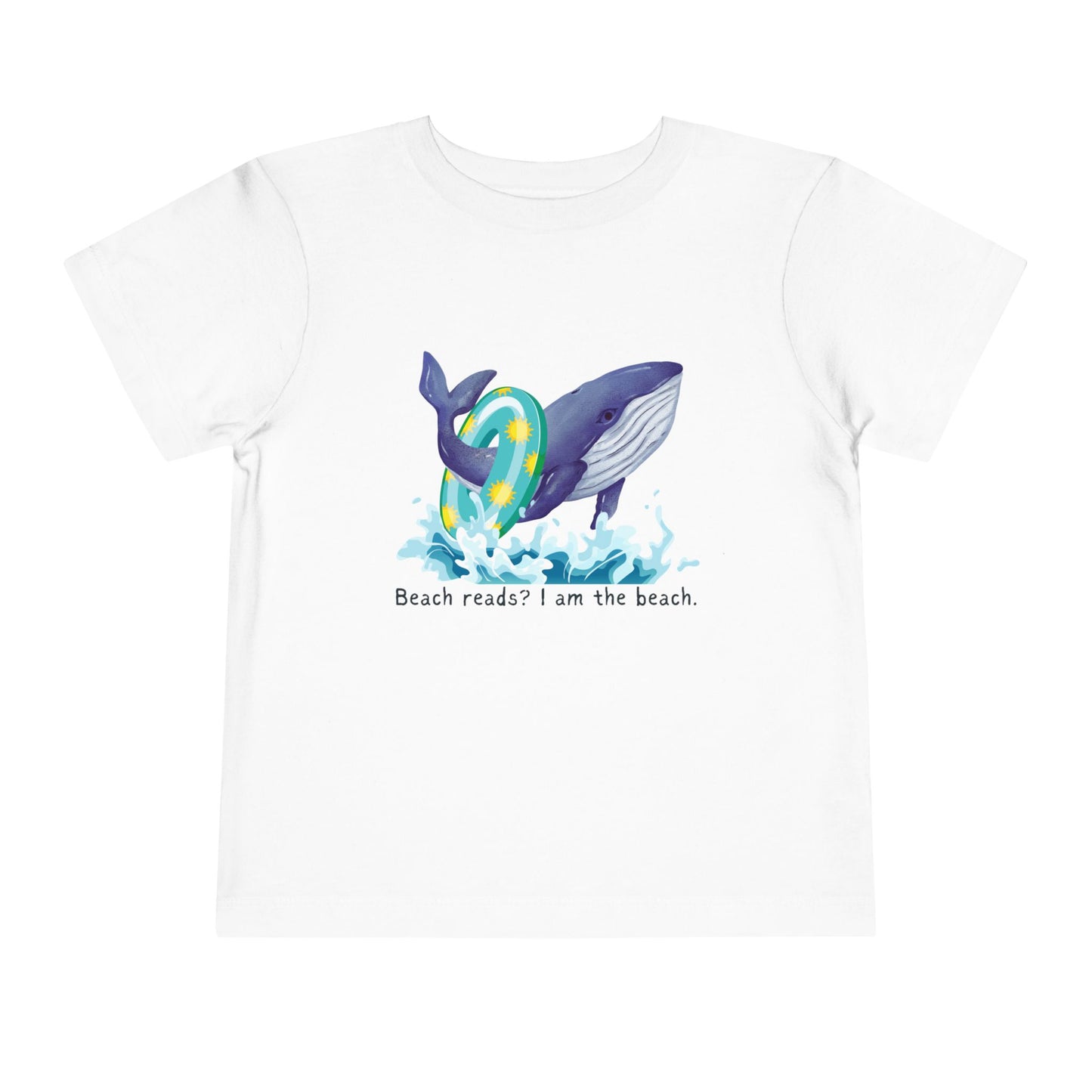 White toddler t-shirt with a whale graphic jumping out of the water with a pool floatie and text 'Beach reads? I am the beach.' 