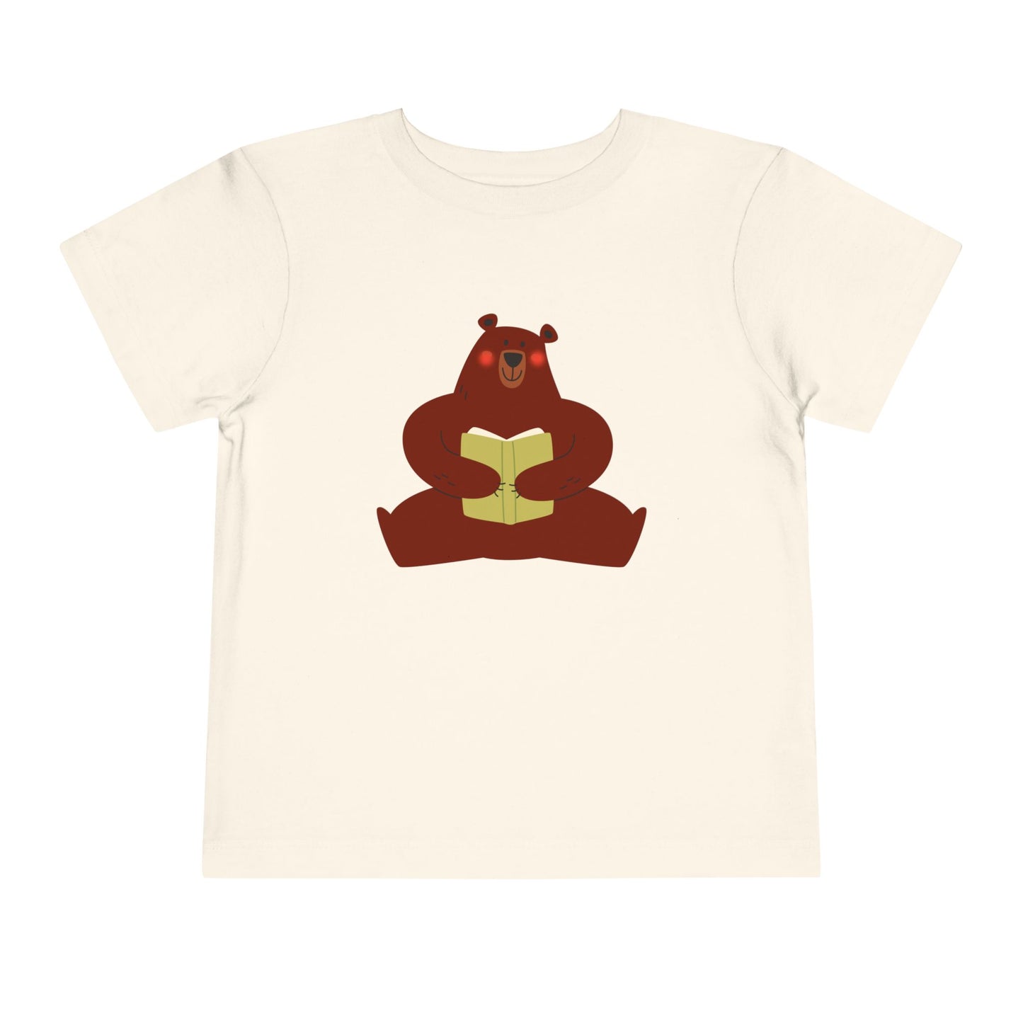 Beige t-shirt with a blushing sear holding a book