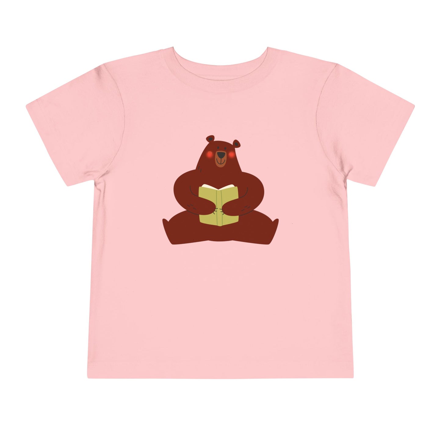 Pink t-shirt with a blushing sear holding a book