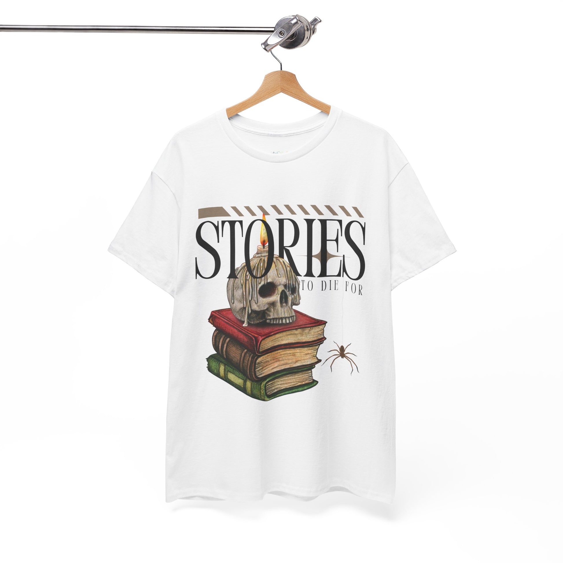 White t-shirt with skull on top of a stack of books, a candle dripping wax on it's head, a spider dangling and text 'Stories To Die For'