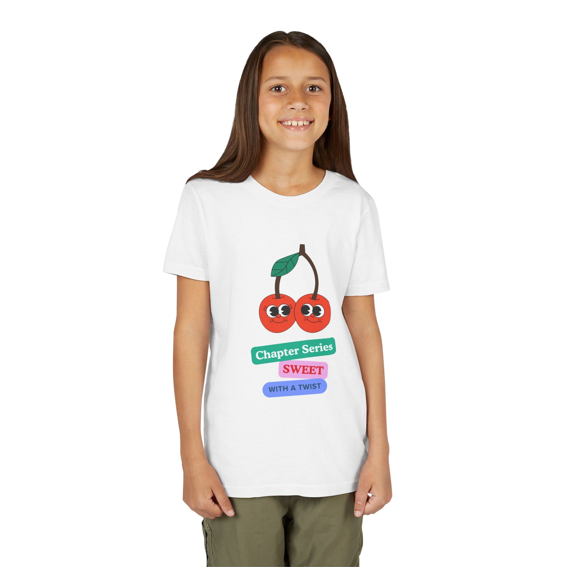 Girl wearing a white t-shirt with a smiling cherry graphic and text 'Chapter Series SWEET With A Twist'
