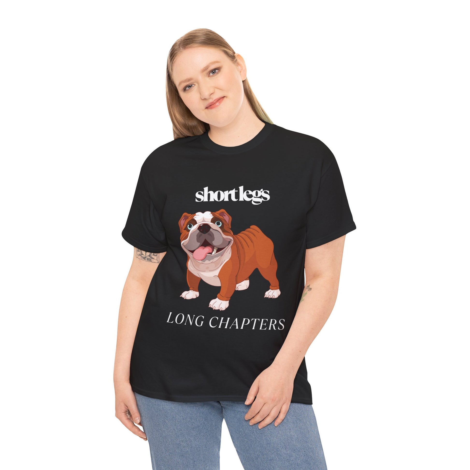 Woman wearing a black t-shirt with a happy bulldog and text 'Short Lets, Long Chapters'