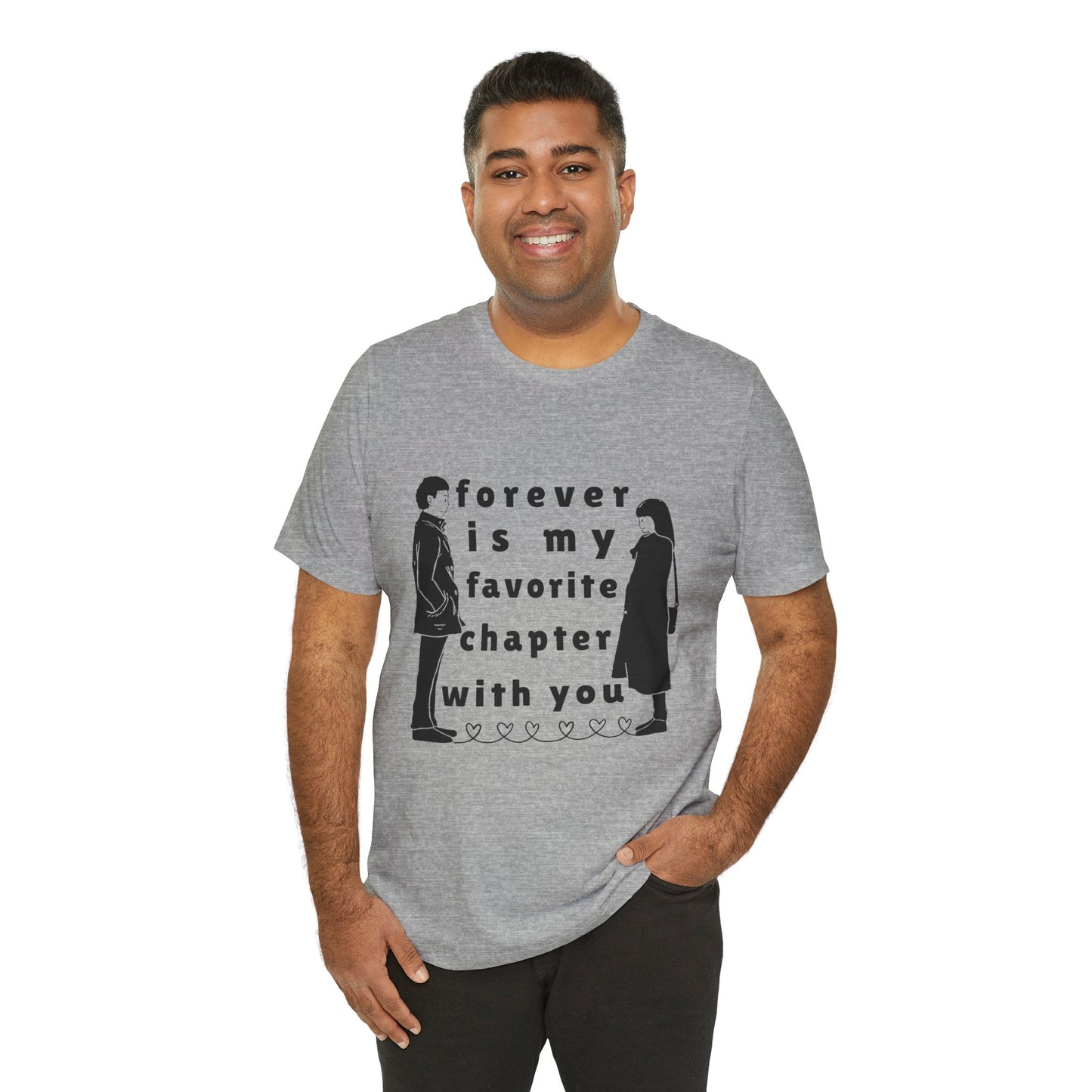 Man wearing a gray t-shirt with black graphics of a man and woman facing each other and in between is text 'Forever Is My Favorite Chapter With You'