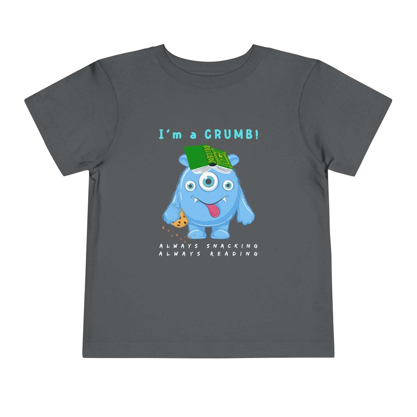 Gray toddler personality t-shirt with a blue cartoon monster eating a cookie and wearing a book on it's head, proudly proclaiming 'I'm A Crumb!' Sub-text 'Always Snacking, Always Reading' on a white background